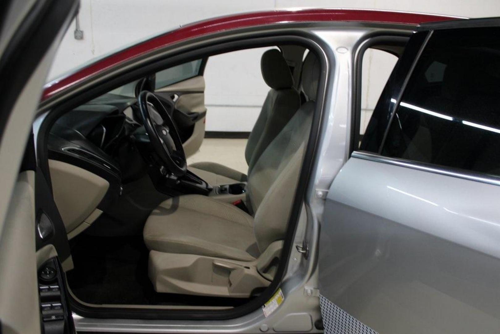 2014 Ingot Silver /Medium Light Stone Ford Focus Electric Base (1FADP3R42EL) with an 107kW Electric Motor engine, Automatic transmission, located at 15300 Midway Rd., Addison, TX, 75001, (972) 702-0011, 32.958321, -96.838074 - Introducing the 2014 Ford Focus Electric, now available at Midway Auto Group in Addison, Texas. This eco-friendly hatchback combines zero-emission performance with modern features, making it an excellent choice for environmentally conscious drivers seeking efficiency without compromising on style.<b - Photo#12