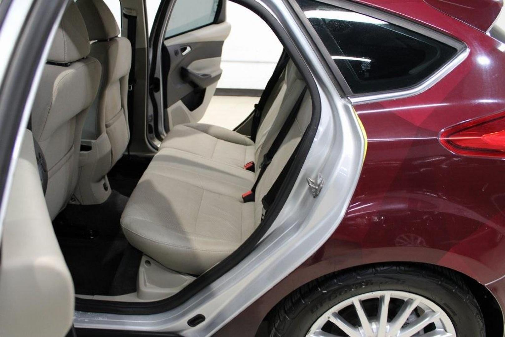 2014 Ingot Silver /Medium Light Stone Ford Focus Electric Base (1FADP3R42EL) with an 107kW Electric Motor engine, Automatic transmission, located at 15300 Midway Rd., Addison, TX, 75001, (972) 702-0011, 32.958321, -96.838074 - Introducing the 2014 Ford Focus Electric, now available at Midway Auto Group in Addison, Texas. This eco-friendly hatchback combines zero-emission performance with modern features, making it an excellent choice for environmentally conscious drivers seeking efficiency without compromising on style.<b - Photo#15