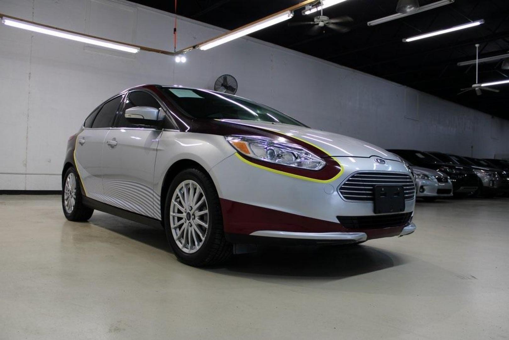 2014 Ingot Silver /Medium Light Stone Ford Focus Electric Base (1FADP3R42EL) with an 107kW Electric Motor engine, Automatic transmission, located at 15300 Midway Rd., Addison, TX, 75001, (972) 702-0011, 32.958321, -96.838074 - Introducing the 2014 Ford Focus Electric, now available at Midway Auto Group in Addison, Texas. This eco-friendly hatchback combines zero-emission performance with modern features, making it an excellent choice for environmentally conscious drivers seeking efficiency without compromising on style.<b - Photo#1