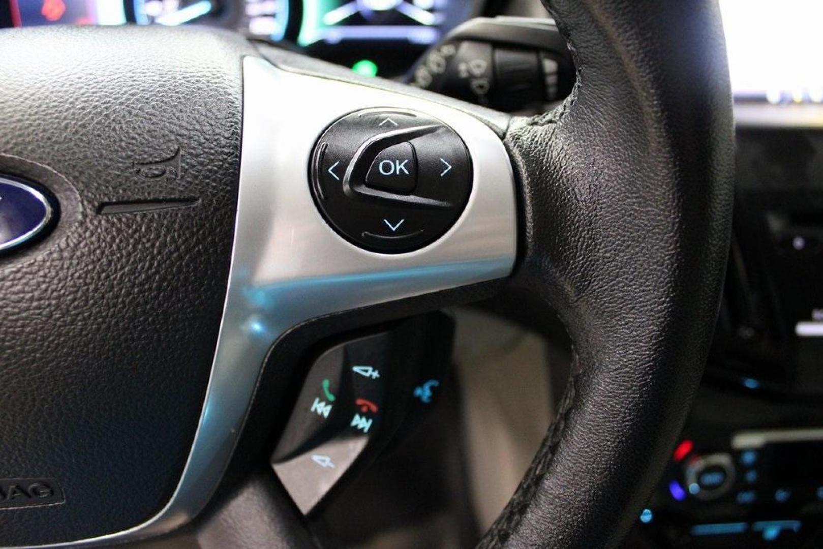 2014 Ingot Silver /Medium Light Stone Ford Focus Electric Base (1FADP3R42EL) with an 107kW Electric Motor engine, Automatic transmission, located at 15300 Midway Rd., Addison, TX, 75001, (972) 702-0011, 32.958321, -96.838074 - Introducing the 2014 Ford Focus Electric, now available at Midway Auto Group in Addison, Texas. This eco-friendly hatchback combines zero-emission performance with modern features, making it an excellent choice for environmentally conscious drivers seeking efficiency without compromising on style.<b - Photo#22