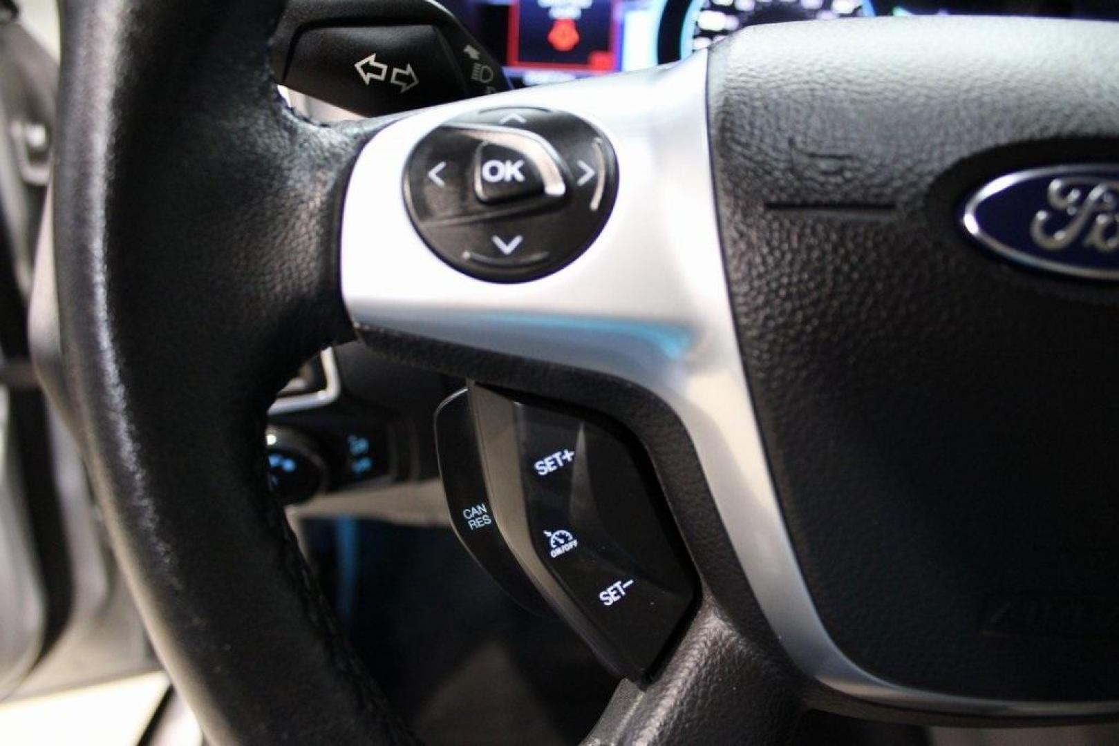 2014 Ingot Silver /Medium Light Stone Ford Focus Electric Base (1FADP3R42EL) with an 107kW Electric Motor engine, Automatic transmission, located at 15300 Midway Rd., Addison, TX, 75001, (972) 702-0011, 32.958321, -96.838074 - Introducing the 2014 Ford Focus Electric, now available at Midway Auto Group in Addison, Texas. This eco-friendly hatchback combines zero-emission performance with modern features, making it an excellent choice for environmentally conscious drivers seeking efficiency without compromising on style.<b - Photo#23