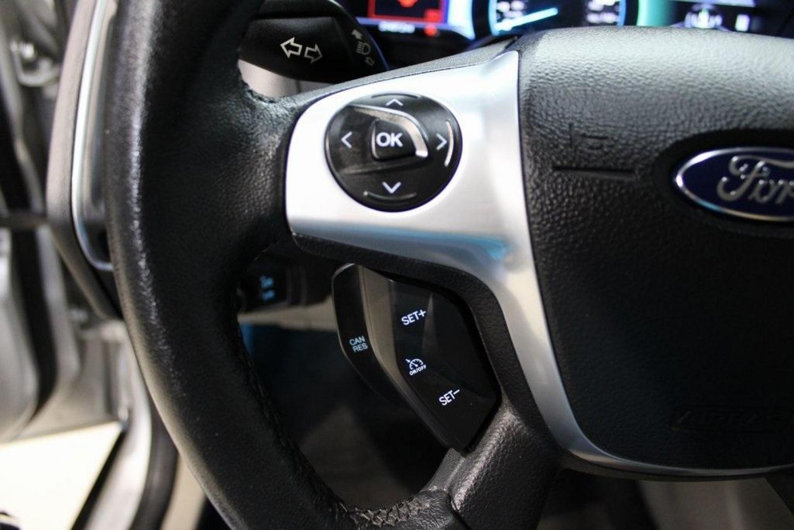 2014 Ingot Silver /Medium Light Stone Ford Focus Electric Base (1FADP3R42EL) with an 107kW Electric Motor engine, Automatic transmission, located at 15300 Midway Rd., Addison, TX, 75001, (972) 702-0011, 32.958321, -96.838074 - Introducing the 2014 Ford Focus Electric, now available at Midway Auto Group in Addison, Texas. This eco-friendly hatchback combines zero-emission performance with modern features, making it an excellent choice for environmentally conscious drivers seeking efficiency without compromising on style.<b - Photo#24