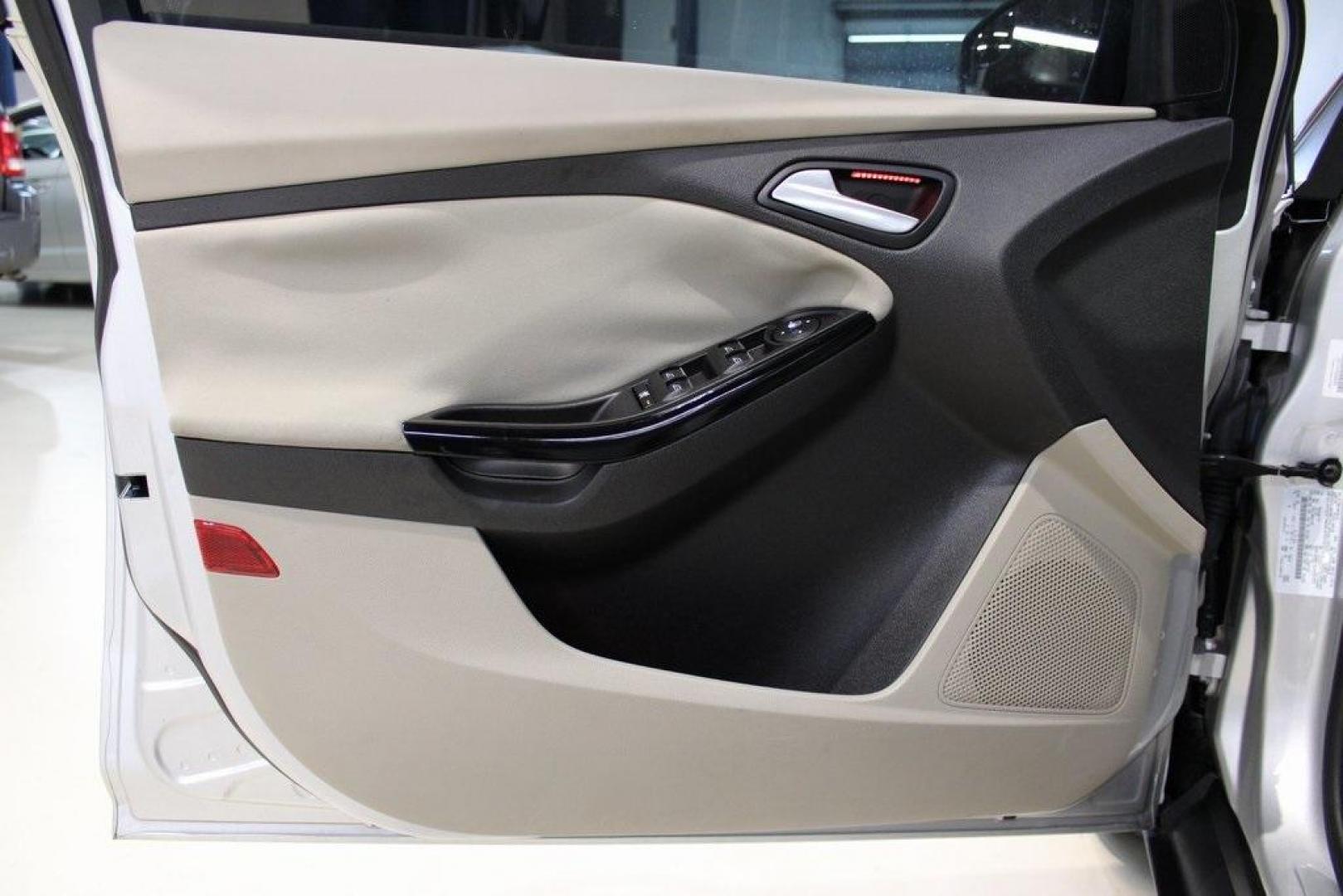 2014 Ingot Silver /Medium Light Stone Ford Focus Electric Base (1FADP3R42EL) with an 107kW Electric Motor engine, Automatic transmission, located at 15300 Midway Rd., Addison, TX, 75001, (972) 702-0011, 32.958321, -96.838074 - Introducing the 2014 Ford Focus Electric, now available at Midway Auto Group in Addison, Texas. This eco-friendly hatchback combines zero-emission performance with modern features, making it an excellent choice for environmentally conscious drivers seeking efficiency without compromising on style.<b - Photo#27