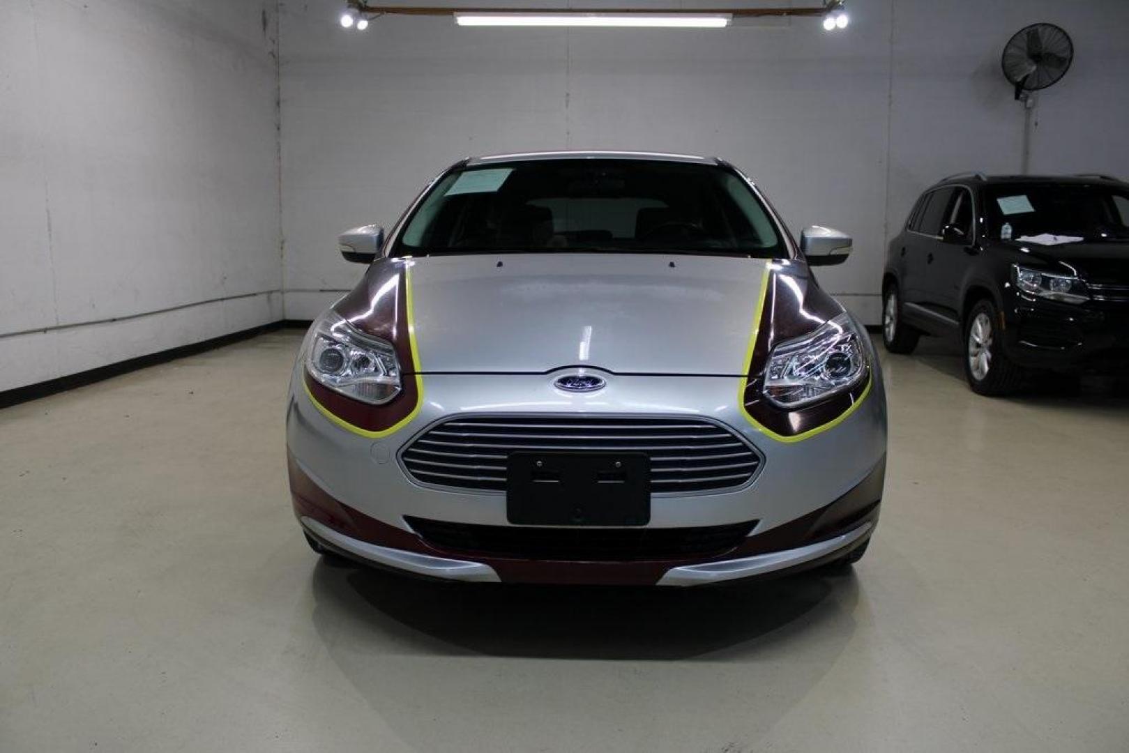 2014 Ingot Silver /Medium Light Stone Ford Focus Electric Base (1FADP3R42EL) with an 107kW Electric Motor engine, Automatic transmission, located at 15300 Midway Rd., Addison, TX, 75001, (972) 702-0011, 32.958321, -96.838074 - Introducing the 2014 Ford Focus Electric, now available at Midway Auto Group in Addison, Texas. This eco-friendly hatchback combines zero-emission performance with modern features, making it an excellent choice for environmentally conscious drivers seeking efficiency without compromising on style.<b - Photo#5