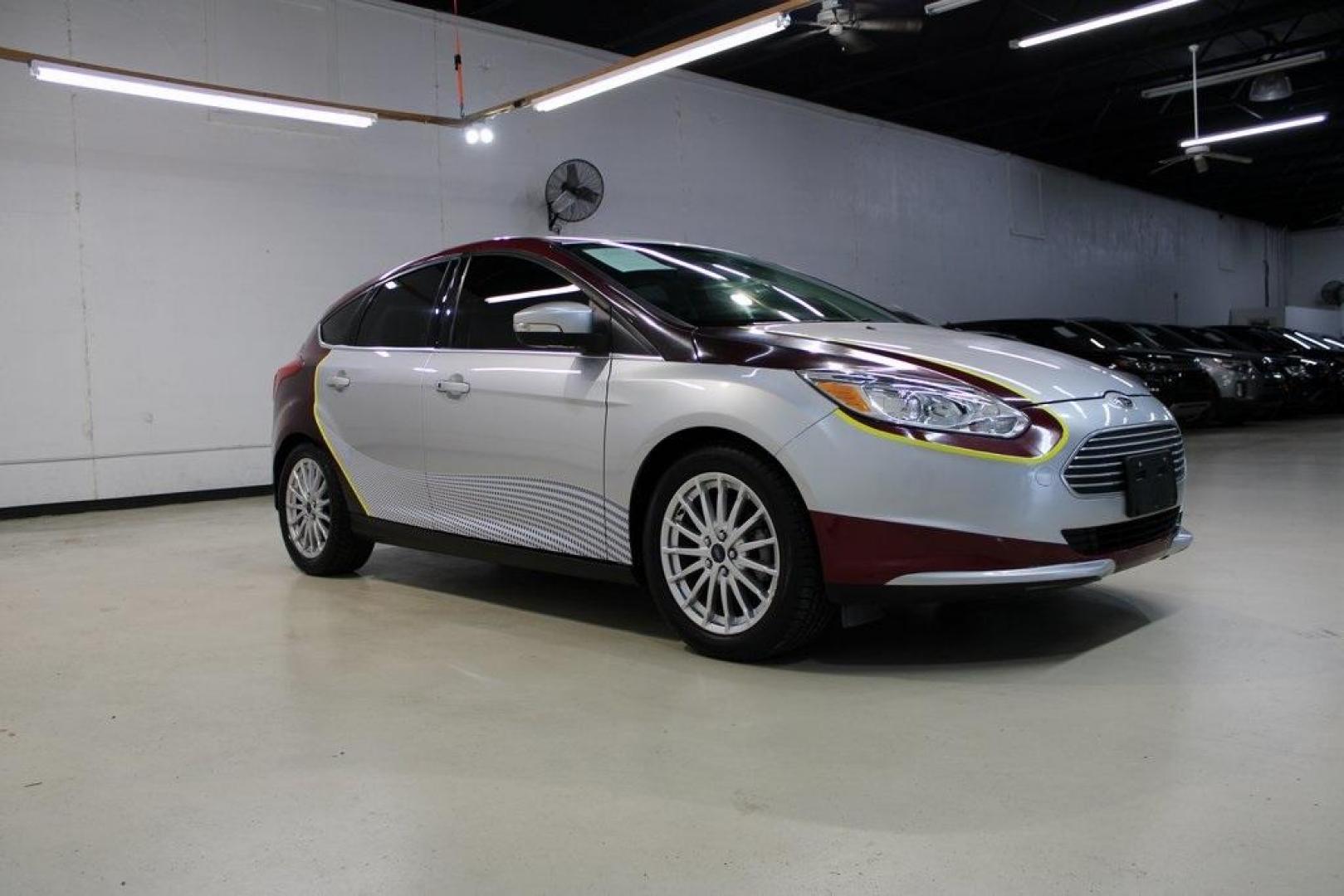 2014 Ingot Silver /Medium Light Stone Ford Focus Electric Base (1FADP3R42EL) with an 107kW Electric Motor engine, Automatic transmission, located at 15300 Midway Rd., Addison, TX, 75001, (972) 702-0011, 32.958321, -96.838074 - Introducing the 2014 Ford Focus Electric, now available at Midway Auto Group in Addison, Texas. This eco-friendly hatchback combines zero-emission performance with modern features, making it an excellent choice for environmentally conscious drivers seeking efficiency without compromising on style.<b - Photo#6
