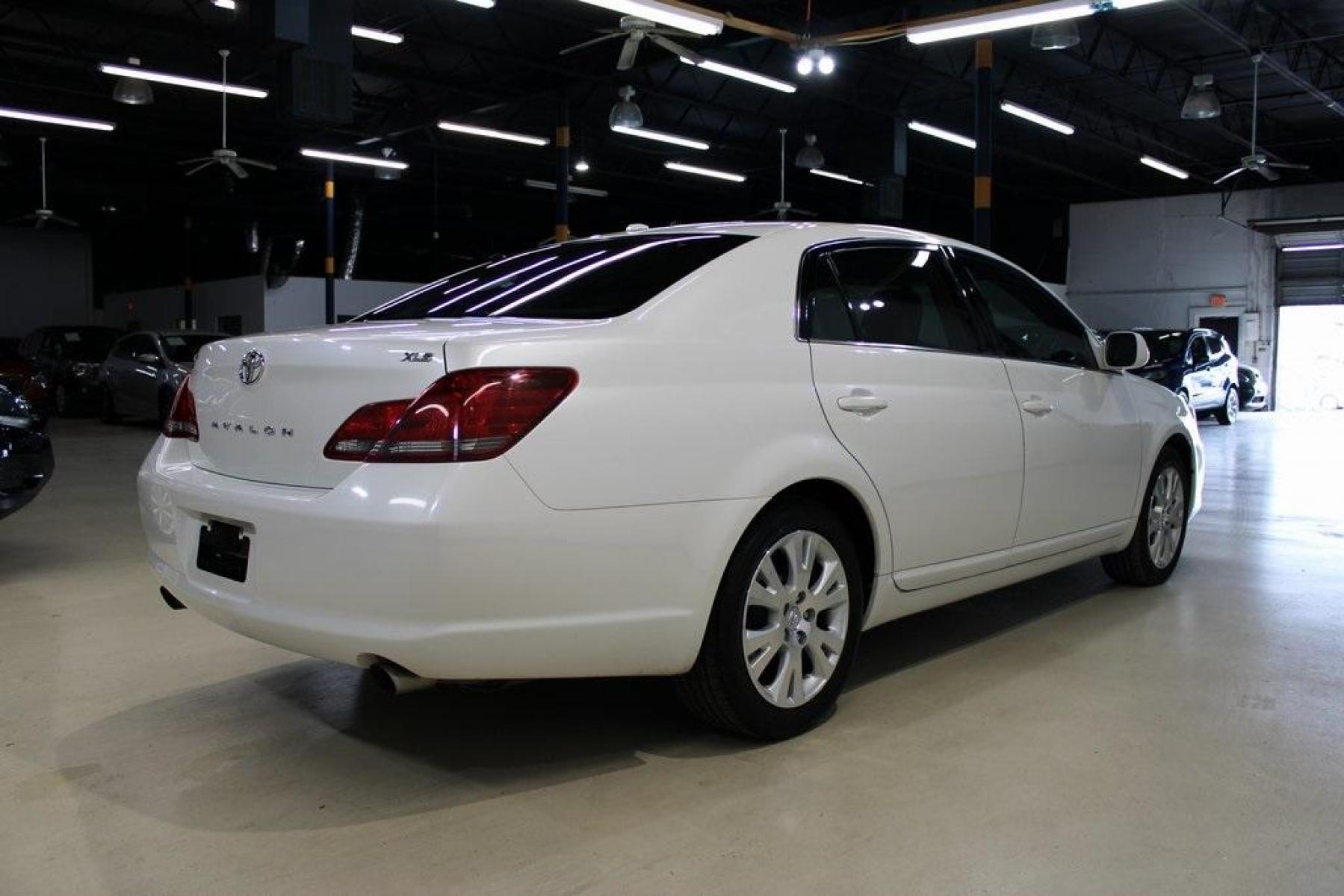 2010 Blizzard Pearl /Ivory Toyota Avalon XLS (4T1BK3DB1AU) with an 3.5L V6 SMPI DOHC engine, Automatic transmission, located at 15300 Midway Rd., Addison, TX, 75001, (972) 702-0011, 32.958321, -96.838074 - HOME OF THE NO HAGGLE PRICE - WHOLESALE PRICES TO THE PUBLIC!! Avalon XLS, 4D Sedan, 3.5L V6 SMPI DOHC, 6-Speed Automatic Electronic with Overdrive, FWD, White, Leather.<br><br>White 2010 Toyota Avalon XLS<br><br>Recent Arrival! 19/28 City/Highway MPG<br><br>Awards:<br> * 2010 KBB.com 10 Most Comfo - Photo #2