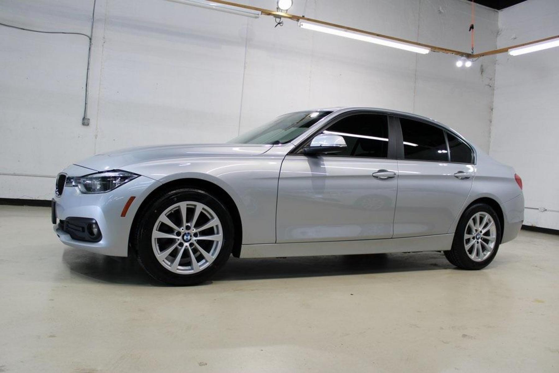 2018 Glacier Silver Metallic /Black BMW 3 Series 320i (WBA8E1G52JN) with an 2.0L 4-Cylinder DOHC 16V TwinPower Turbo engine, Automatic transmission, located at 15300 Midway Rd., Addison, TX, 75001, (972) 702-0011, 32.958321, -96.838074 - HOME OF THE NO HAGGLE PRICE - WHOLESALE PRICES TO THE PUBLIC!! 320i, 4D Sedan, 2.0L 4-Cylinder DOHC 16V TwinPower Turbo, 8-Speed Automatic, RWD, Glacier Silver Metallic, Black Artificial Leather.<br><br>Glacier Silver Metallic 2018 BMW 3 Series 320i<br><br>Recent Arrival! 24/35 City/Highway MPG<br>< - Photo #5