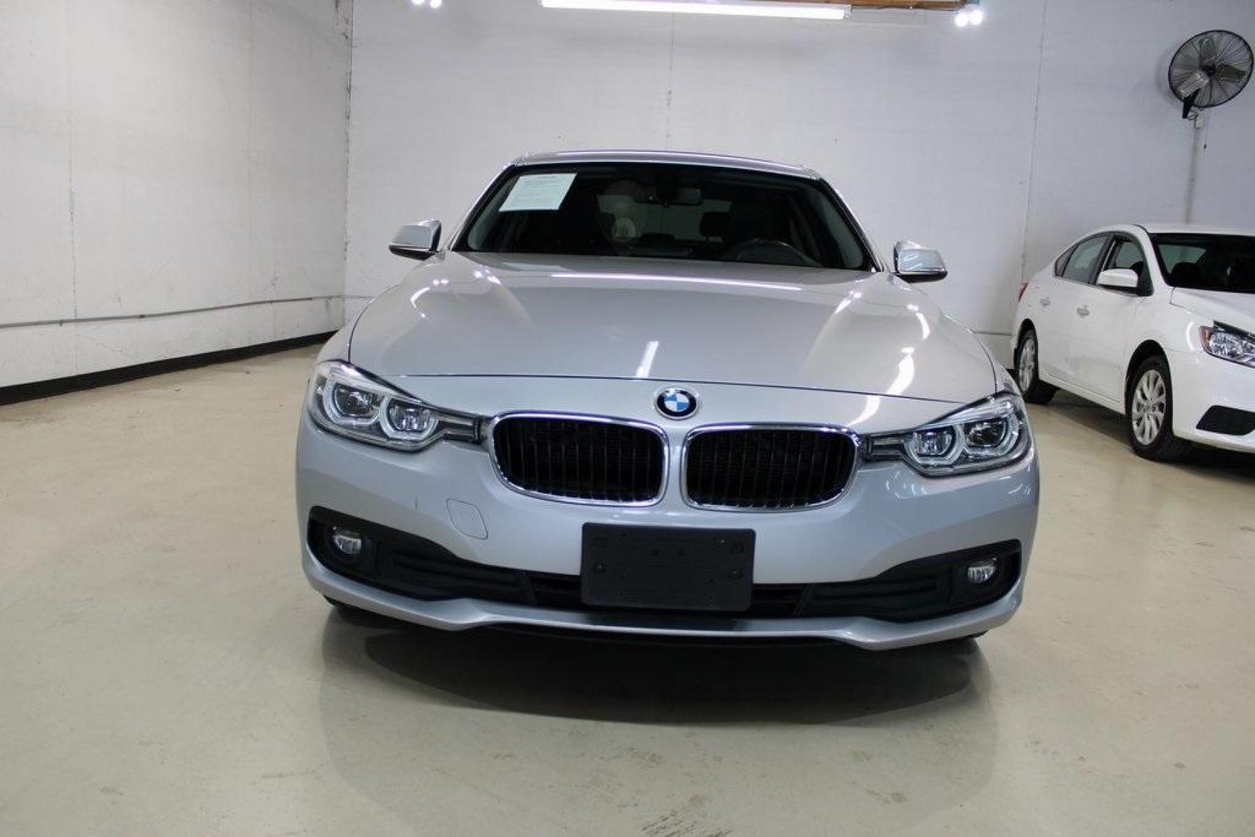 2018 Glacier Silver Metallic /Black BMW 3 Series 320i (WBA8E1G52JN) with an 2.0L 4-Cylinder DOHC 16V TwinPower Turbo engine, Automatic transmission, located at 15300 Midway Rd., Addison, TX, 75001, (972) 702-0011, 32.958321, -96.838074 - HOME OF THE NO HAGGLE PRICE - WHOLESALE PRICES TO THE PUBLIC!! 320i, 4D Sedan, 2.0L 4-Cylinder DOHC 16V TwinPower Turbo, 8-Speed Automatic, RWD, Glacier Silver Metallic, Black Artificial Leather.<br><br>Glacier Silver Metallic 2018 BMW 3 Series 320i<br><br>Recent Arrival! 24/35 City/Highway MPG<br>< - Photo #6