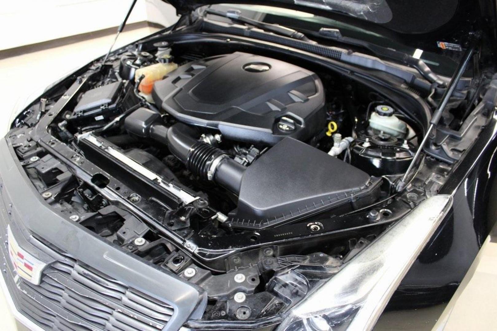 2017 Black Raven /Jet Black With Jet Black Accents Cadillac ATS 3.6L Premium Luxury (1G6AE1RSXH0) with an 3.6L V6 SIDI DOHC VVT engine, Automatic transmission, located at 15300 Midway Rd., Addison, TX, 75001, (972) 702-0011, 32.958321, -96.838074 - HOME OF THE NO HAGGLE PRICE - WHOLESALE PRICES TO THE PUBLIC!! ATS 3.6L Premium Luxury, 2D Coupe, 3.6L V6 SIDI DOHC VVT, 8-Speed Automatic, RWD, Black Raven, Jet Black With Jet Black Accents Leather.<br><br>Black Raven 2017 Cadillac ATS 3.6L Premium Luxury<br><br>20/30 City/Highway MPG<br><br><br>At - Photo#28