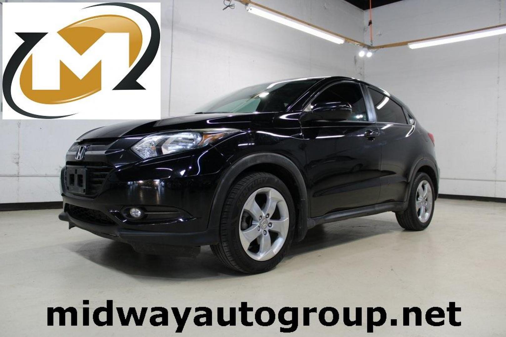 2016 Crystal Black Pearl Honda HR-V EX (3CZRU5G52GM) with an 1.8L I4 SOHC 16V i-VTEC engine, Manual transmission, located at 15300 Midway Rd., Addison, TX, 75001, (972) 702-0011, 32.958321, -96.838074 - Photo#0