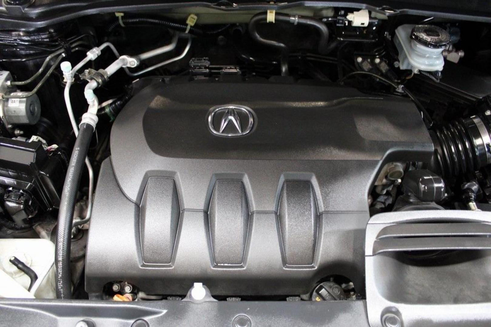 2015 Graphite Luster Metallic /Parchment Acura RDX Technology Package (5J8TB4H53FL) with an 3.5L V6 SOHC i-VTEC 24V engine, Automatic transmission, located at 15300 Midway Rd., Addison, TX, 75001, (972) 702-0011, 32.958321, -96.838074 - HOME OF THE NO HAGGLE PRICE - WHOLESALE PRICES TO THE PUBLIC!! RDX Technology Package, 4D Sport Utility, 3.5L V6 SOHC i-VTEC 24V, 6-Speed Automatic, AWD, Gray, Leather.<br><br>Gray 2015 Acura RDX Technology Package<br><br>19/27 City/Highway MPG<br><br>Awards:<br> * 2015 KBB.com 10 Best Luxury Cars - Photo#31