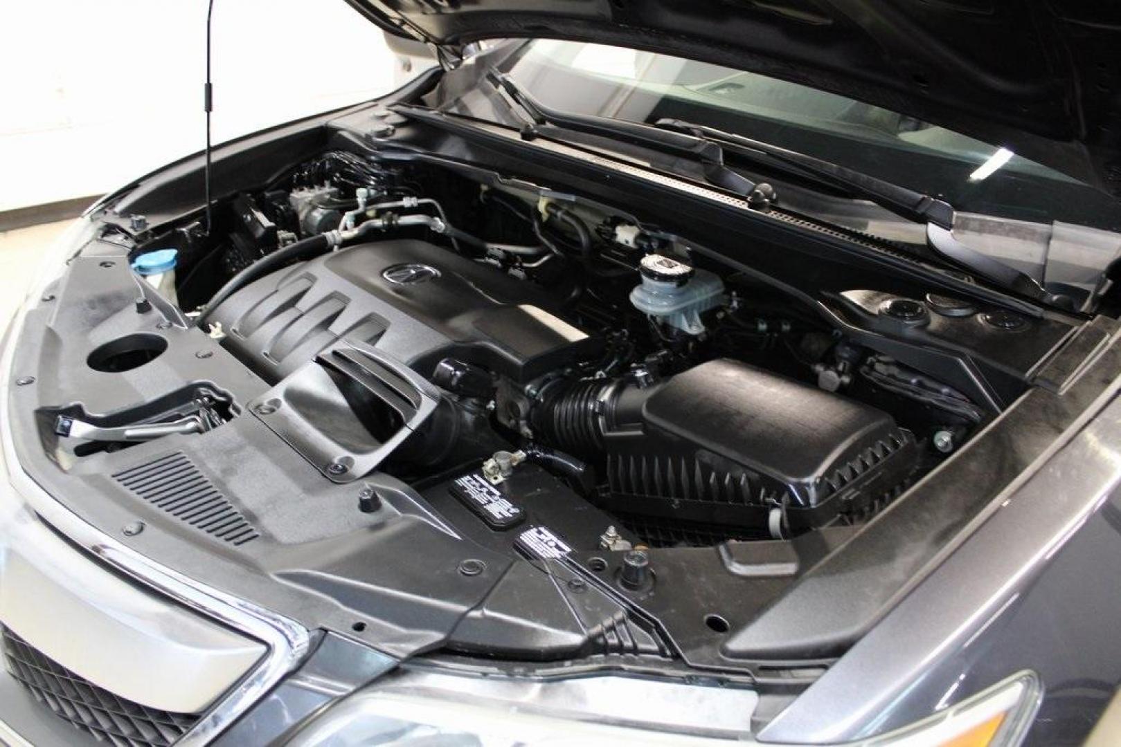 2015 Graphite Luster Metallic /Parchment Acura RDX Technology Package (5J8TB4H53FL) with an 3.5L V6 SOHC i-VTEC 24V engine, Automatic transmission, located at 15300 Midway Rd., Addison, TX, 75001, (972) 702-0011, 32.958321, -96.838074 - HOME OF THE NO HAGGLE PRICE - WHOLESALE PRICES TO THE PUBLIC!! RDX Technology Package, 4D Sport Utility, 3.5L V6 SOHC i-VTEC 24V, 6-Speed Automatic, AWD, Gray, Leather.<br><br>Gray 2015 Acura RDX Technology Package<br><br>19/27 City/Highway MPG<br><br>Awards:<br> * 2015 KBB.com 10 Best Luxury Cars - Photo#32