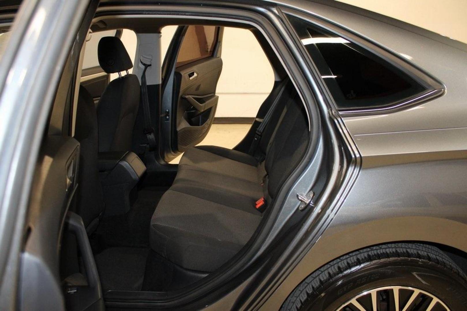 2021 Pyrite Silver Metallic /Storm Gray Volkswagen Jetta 1.4T S (3VWC57BU6MM) with an 1.4L TSI engine, Automatic transmission, located at 15300 Midway Rd., Addison, TX, 75001, (972) 702-0011, 32.958321, -96.838074 - HOME OF THE NO HAGGLE PRICE - WHOLESALE PRICES TO THE PUBLIC!! Jetta 1.4T S, 4D Sedan, 1.4L TSI, 8-Speed Automatic, FWD.<br><br>Pyrite Silver Metallic 2021 Volkswagen Jetta 1.4T S<br><br>29/39 City/Highway MPG<br><br><br>At Midway Auto Group, we strive to provide you with the best quality vehicles f - Photo#14