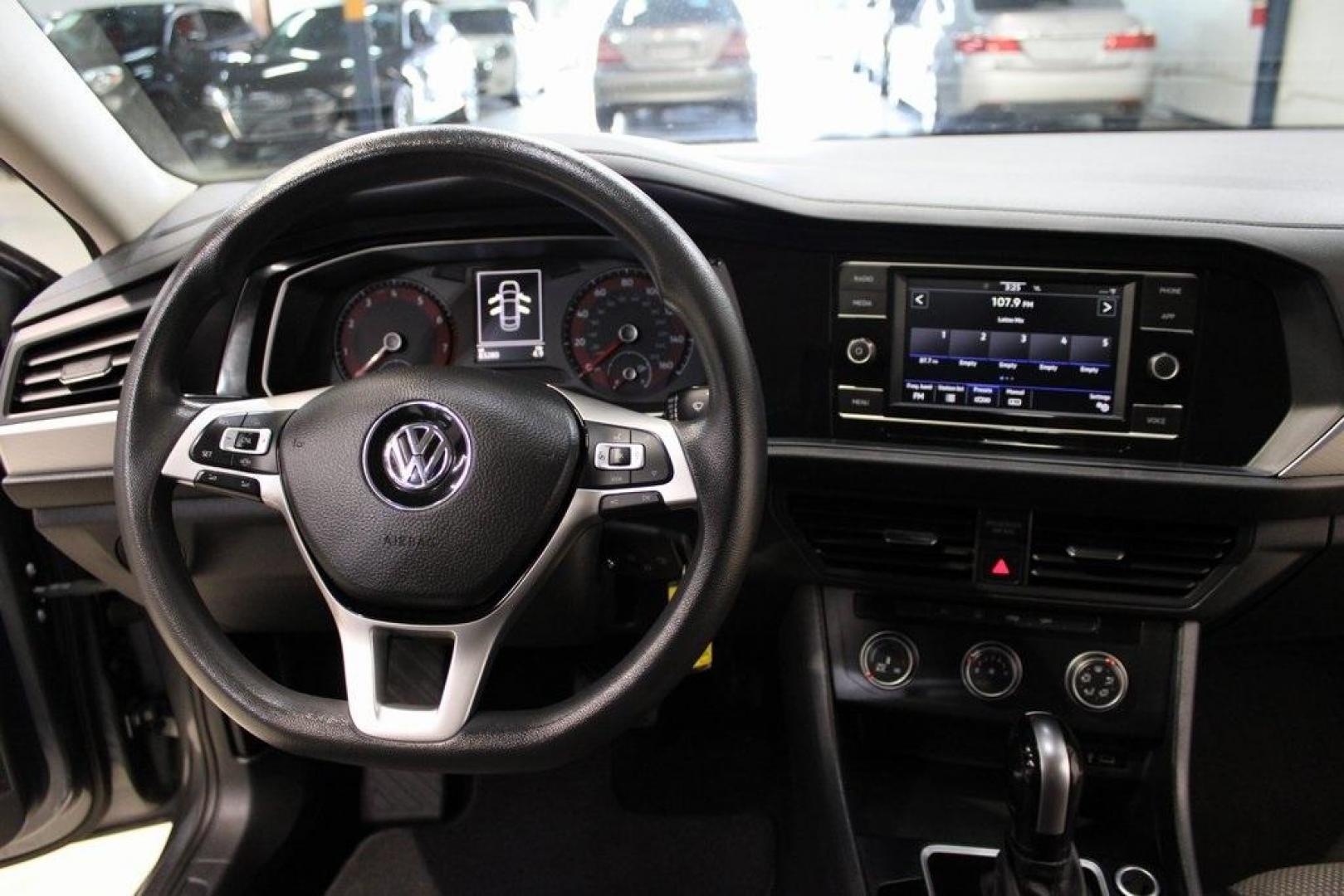 2021 Pyrite Silver Metallic /Storm Gray Volkswagen Jetta 1.4T S (3VWC57BU6MM) with an 1.4L TSI engine, Automatic transmission, located at 15300 Midway Rd., Addison, TX, 75001, (972) 702-0011, 32.958321, -96.838074 - HOME OF THE NO HAGGLE PRICE - WHOLESALE PRICES TO THE PUBLIC!! Jetta 1.4T S, 4D Sedan, 1.4L TSI, 8-Speed Automatic, FWD.<br><br>Pyrite Silver Metallic 2021 Volkswagen Jetta 1.4T S<br><br>29/39 City/Highway MPG<br><br><br>At Midway Auto Group, we strive to provide you with the best quality vehicles f - Photo#15