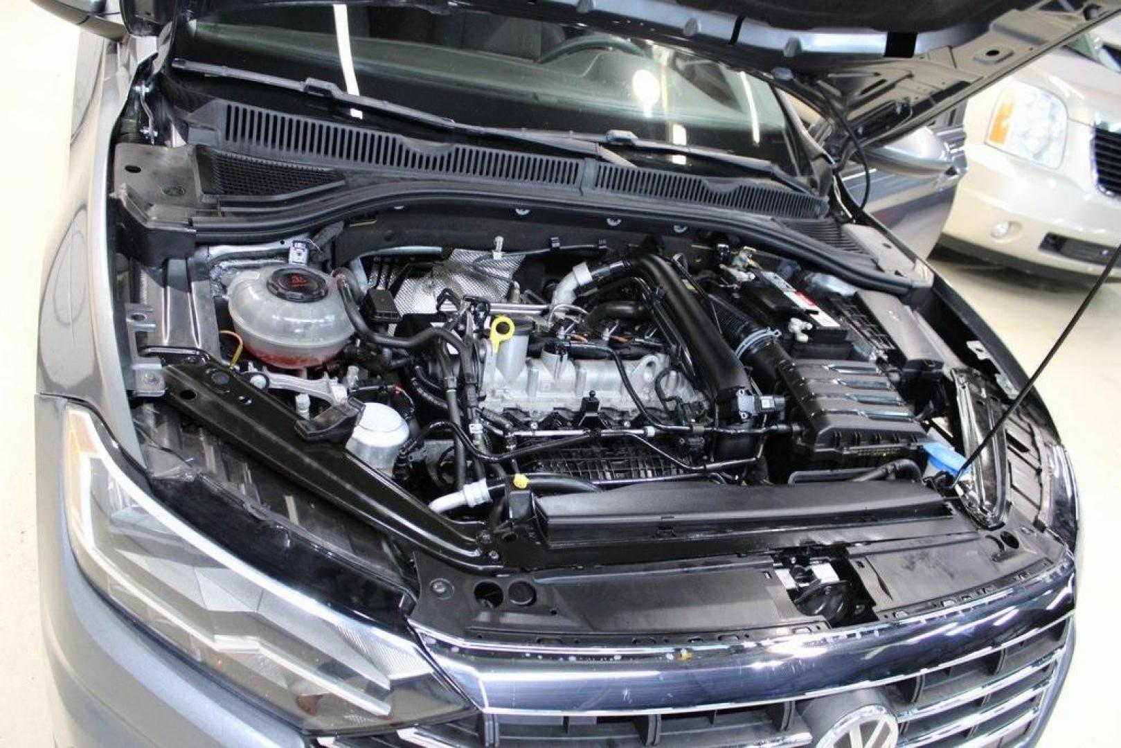 2021 Pyrite Silver Metallic /Storm Gray Volkswagen Jetta 1.4T S (3VWC57BU6MM) with an 1.4L TSI engine, Automatic transmission, located at 15300 Midway Rd., Addison, TX, 75001, (972) 702-0011, 32.958321, -96.838074 - HOME OF THE NO HAGGLE PRICE - WHOLESALE PRICES TO THE PUBLIC!! Jetta 1.4T S, 4D Sedan, 1.4L TSI, 8-Speed Automatic, FWD.<br><br>Pyrite Silver Metallic 2021 Volkswagen Jetta 1.4T S<br><br>29/39 City/Highway MPG<br><br><br>At Midway Auto Group, we strive to provide you with the best quality vehicles f - Photo#26