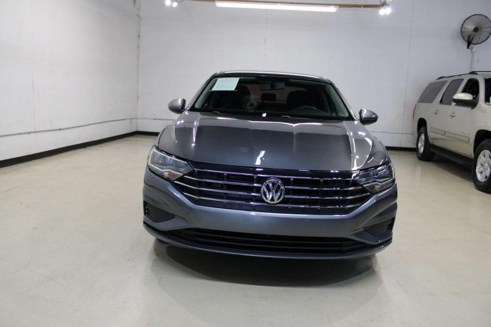 2021 Pyrite Silver Metallic /Storm Gray Volkswagen Jetta 1.4T S (3VWC57BU6MM) with an 1.4L TSI engine, Automatic transmission, located at 15300 Midway Rd., Addison, TX, 75001, (972) 702-0011, 32.958321, -96.838074 - HOME OF THE NO HAGGLE PRICE - WHOLESALE PRICES TO THE PUBLIC!! Jetta 1.4T S, 4D Sedan, 1.4L TSI, 8-Speed Automatic, FWD.<br><br>Pyrite Silver Metallic 2021 Volkswagen Jetta 1.4T S<br><br>29/39 City/Highway MPG<br><br><br>At Midway Auto Group, we strive to provide you with the best quality vehicles f - Photo#5