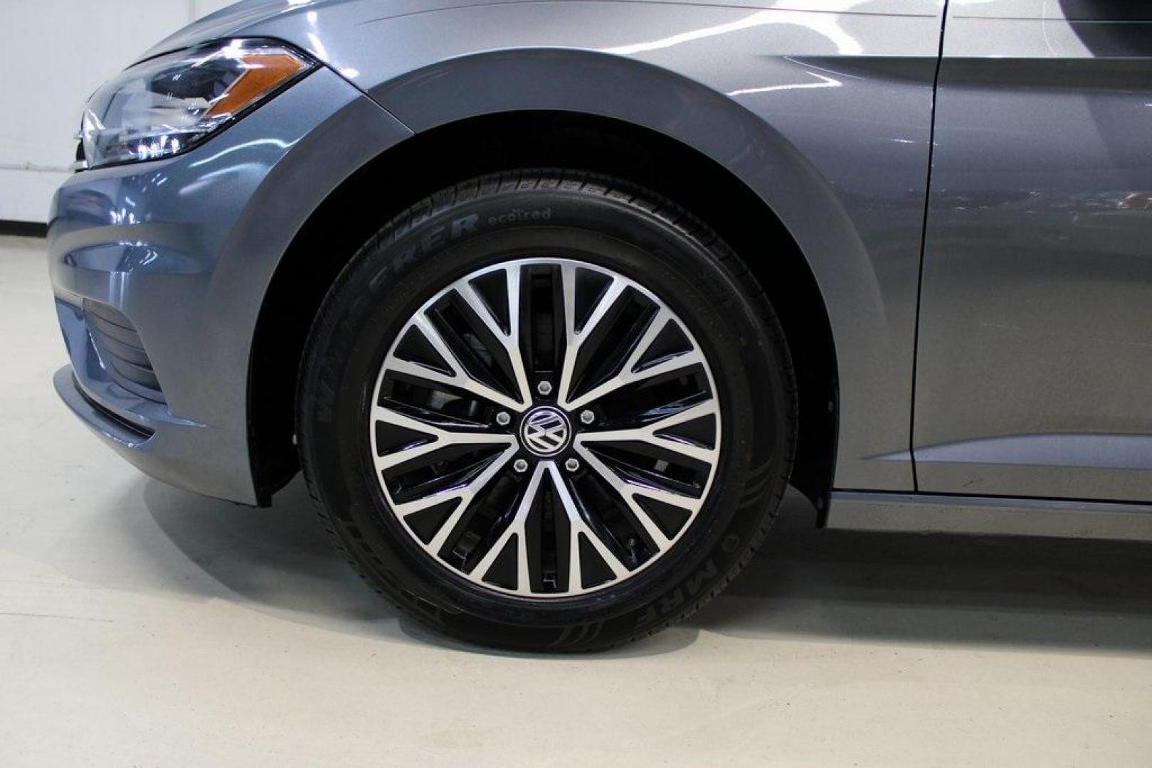 2021 Pyrite Silver Metallic /Storm Gray Volkswagen Jetta 1.4T S (3VWC57BU6MM) with an 1.4L TSI engine, Automatic transmission, located at 15300 Midway Rd., Addison, TX, 75001, (972) 702-0011, 32.958321, -96.838074 - HOME OF THE NO HAGGLE PRICE - WHOLESALE PRICES TO THE PUBLIC!! Jetta 1.4T S, 4D Sedan, 1.4L TSI, 8-Speed Automatic, FWD.<br><br>Pyrite Silver Metallic 2021 Volkswagen Jetta 1.4T S<br><br>29/39 City/Highway MPG<br><br><br>At Midway Auto Group, we strive to provide you with the best quality vehicles f - Photo#8