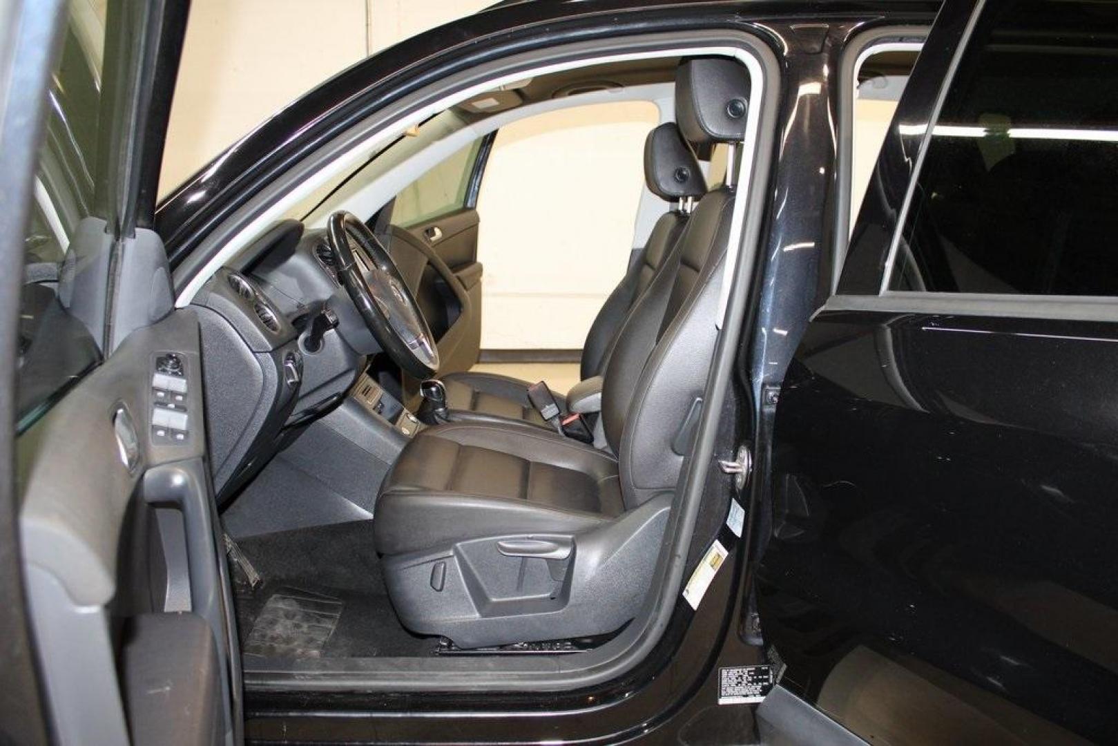2017 Deep Black /Charcoal Black Volkswagen Tiguan 2.0T S (WVGAV7AX3HK) with an 2.0L TSI DOHC engine, Automatic transmission, located at 15300 Midway Rd., Addison, TX, 75001, (972) 702-0011, 32.958321, -96.838074 - HOME OF THE NO HAGGLE PRICE - WHOLESALE PRICES TO THE PUBLIC!! Tiguan 2.0T S, 4D Sport Utility, 2.0L TSI DOHC, 6-Speed Automatic with Tiptronic, FWD, Black, Charcoal Black w/V-Tex Leatherette Seating Surfaces.<br><br>Black 2017 Volkswagen Tiguan 2.0T S<br><br><br>At Midway Auto Group, we strive to p - Photo#13