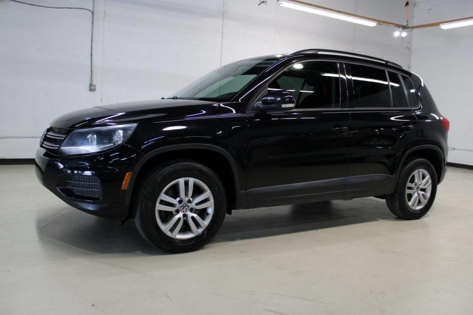 2017 Deep Black /Charcoal Black Volkswagen Tiguan 2.0T S (WVGAV7AX3HK) with an 2.0L TSI DOHC engine, Automatic transmission, located at 15300 Midway Rd., Addison, TX, 75001, (972) 702-0011, 32.958321, -96.838074 - HOME OF THE NO HAGGLE PRICE - WHOLESALE PRICES TO THE PUBLIC!! Tiguan 2.0T S, 4D Sport Utility, 2.0L TSI DOHC, 6-Speed Automatic with Tiptronic, FWD, Black, Charcoal Black w/V-Tex Leatherette Seating Surfaces.<br><br>Black 2017 Volkswagen Tiguan 2.0T S<br><br><br>At Midway Auto Group, we strive to p - Photo#4