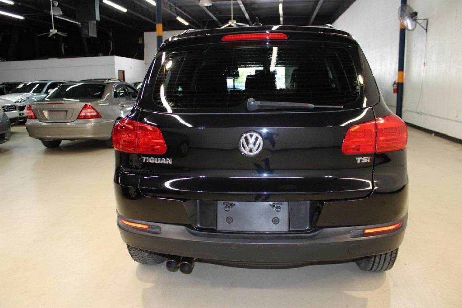2017 Deep Black /Charcoal Black Volkswagen Tiguan 2.0T S (WVGAV7AX3HK) with an 2.0L TSI DOHC engine, Automatic transmission, located at 15300 Midway Rd., Addison, TX, 75001, (972) 702-0011, 32.958321, -96.838074 - HOME OF THE NO HAGGLE PRICE - WHOLESALE PRICES TO THE PUBLIC!! Tiguan 2.0T S, 4D Sport Utility, 2.0L TSI DOHC, 6-Speed Automatic with Tiptronic, FWD, Black, Charcoal Black w/V-Tex Leatherette Seating Surfaces.<br><br>Black 2017 Volkswagen Tiguan 2.0T S<br><br><br>At Midway Auto Group, we strive to p - Photo#7
