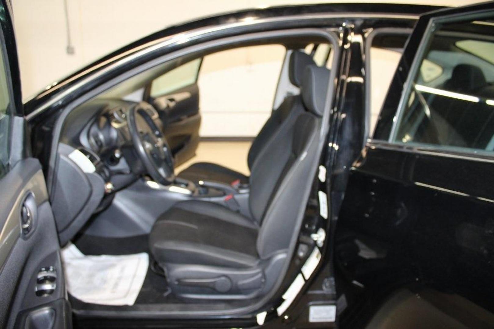 2018 Super Black /Charcoal Nissan Sentra S (3N1AB7AP0JY) with an 1.8L 4-Cylinder DOHC 16V engine, CVT transmission, located at 15300 Midway Rd., Addison, TX, 75001, (972) 702-0011, 32.958321, -96.838074 - Photo#12