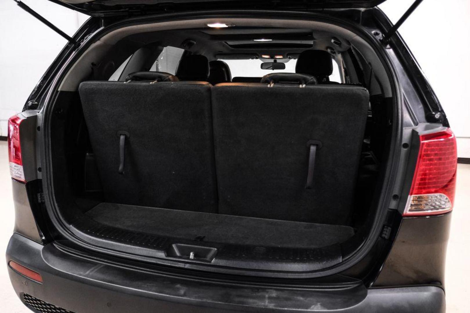 2012 Ebony Black /Black Kia Sorento EX (5XYKU4A29CG) with an 3.5L V6 DOHC Dual CVVT engine, Automatic transmission, located at 15300 Midway Rd., Addison, TX, 75001, (972) 702-0011, 32.958321, -96.838074 - Photo#50