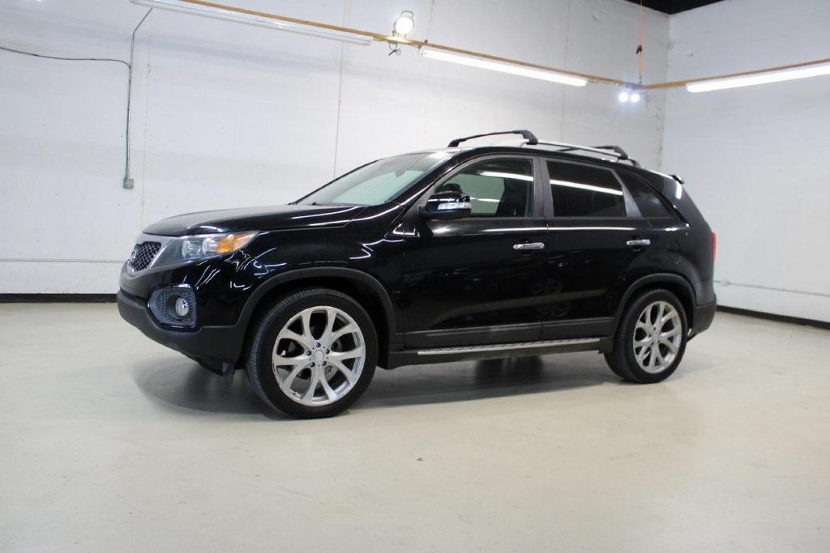 2012 Ebony Black /Black Kia Sorento EX (5XYKU4A29CG) with an 3.5L V6 DOHC Dual CVVT engine, Automatic transmission, located at 15300 Midway Rd., Addison, TX, 75001, (972) 702-0011, 32.958321, -96.838074 - Introducing the 2012 Kia Sorento EX, now available at Midway Auto Group in Addison, Texas. This midsize SUV offers a compelling blend of performance, comfort, and advanced features, making it an excellent choice for families and individuals seeking versatility and reliability.<br><br>Key Features:<b - Photo#4