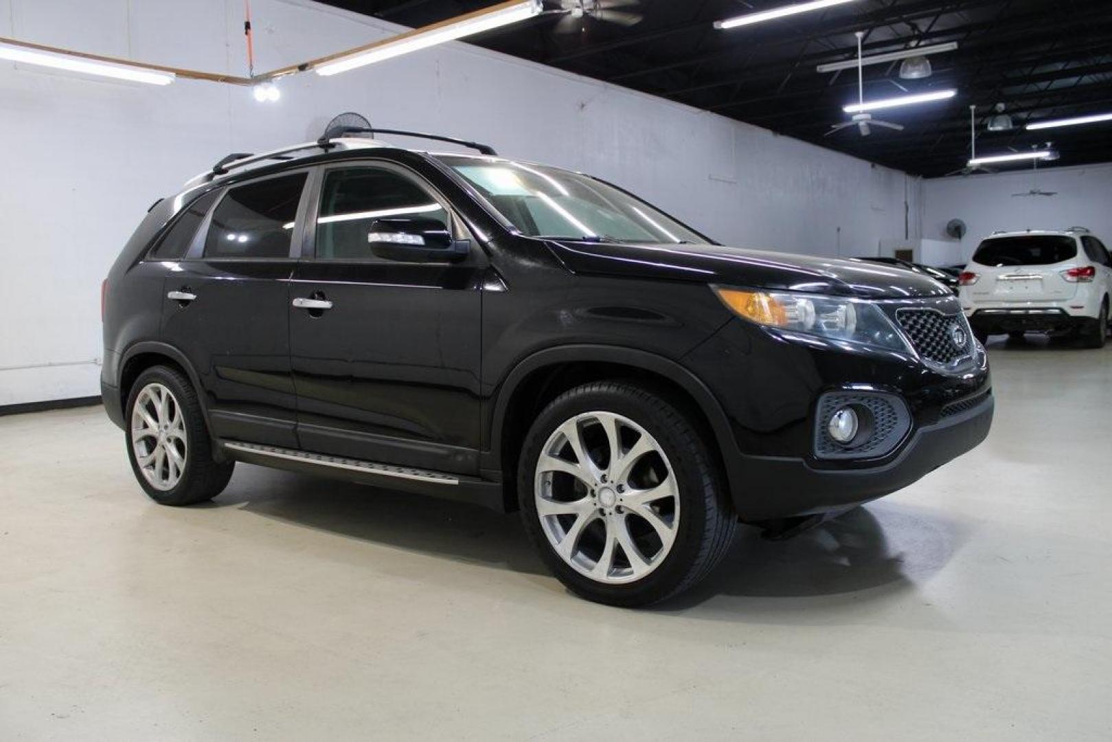 2012 Ebony Black /Black Kia Sorento EX (5XYKU4A29CG) with an 3.5L V6 DOHC Dual CVVT engine, Automatic transmission, located at 15300 Midway Rd., Addison, TX, 75001, (972) 702-0011, 32.958321, -96.838074 - Introducing the 2012 Kia Sorento EX, now available at Midway Auto Group in Addison, Texas. This midsize SUV offers a compelling blend of performance, comfort, and advanced features, making it an excellent choice for families and individuals seeking versatility and reliability.<br><br>Key Features:<b - Photo#6