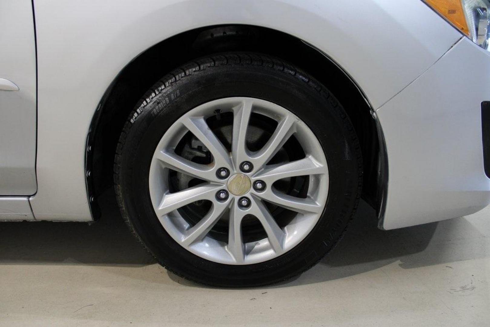 2013 Ice Silver Metallic /Black Subaru Impreza 2.0i Premium (JF1GJAB61DH) with an 2.0L 4-Cylinder SMPI DOHC 16V engine, CVT transmission, located at 15300 Midway Rd., Addison, TX, 75001, (972) 702-0011, 32.958321, -96.838074 - Introducing the 2013 Subaru Impreza 2.0i, now available at Midway Auto Group in Addison, Texas. This compact sedan seamlessly combines efficiency, versatility, and Subaru's renowned all-wheel-drive capability, making it an excellent choice for both city commutes and weekend adventures.<br><br>Key Fe - Photo#11