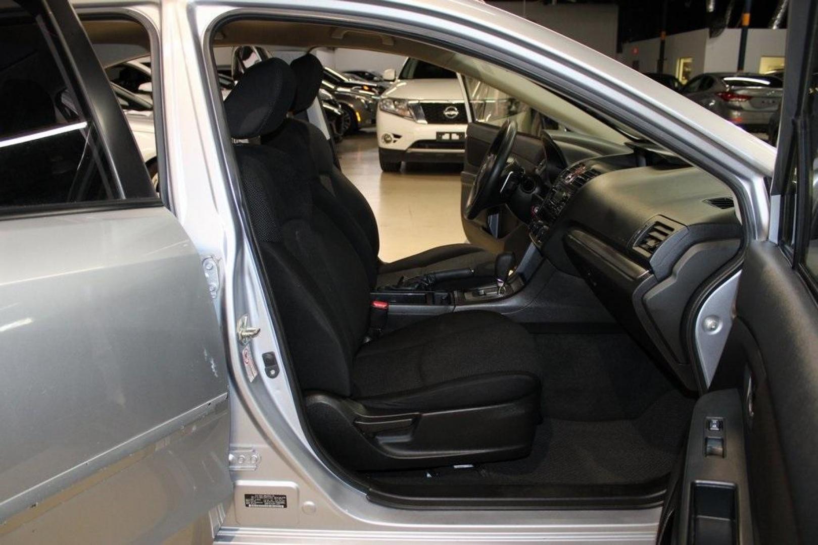 2013 Ice Silver Metallic /Black Subaru Impreza 2.0i Premium (JF1GJAB61DH) with an 2.0L 4-Cylinder SMPI DOHC 16V engine, CVT transmission, located at 15300 Midway Rd., Addison, TX, 75001, (972) 702-0011, 32.958321, -96.838074 - Introducing the 2013 Subaru Impreza 2.0i, now available at Midway Auto Group in Addison, Texas. This compact sedan seamlessly combines efficiency, versatility, and Subaru's renowned all-wheel-drive capability, making it an excellent choice for both city commutes and weekend adventures.<br><br>Key Fe - Photo#12