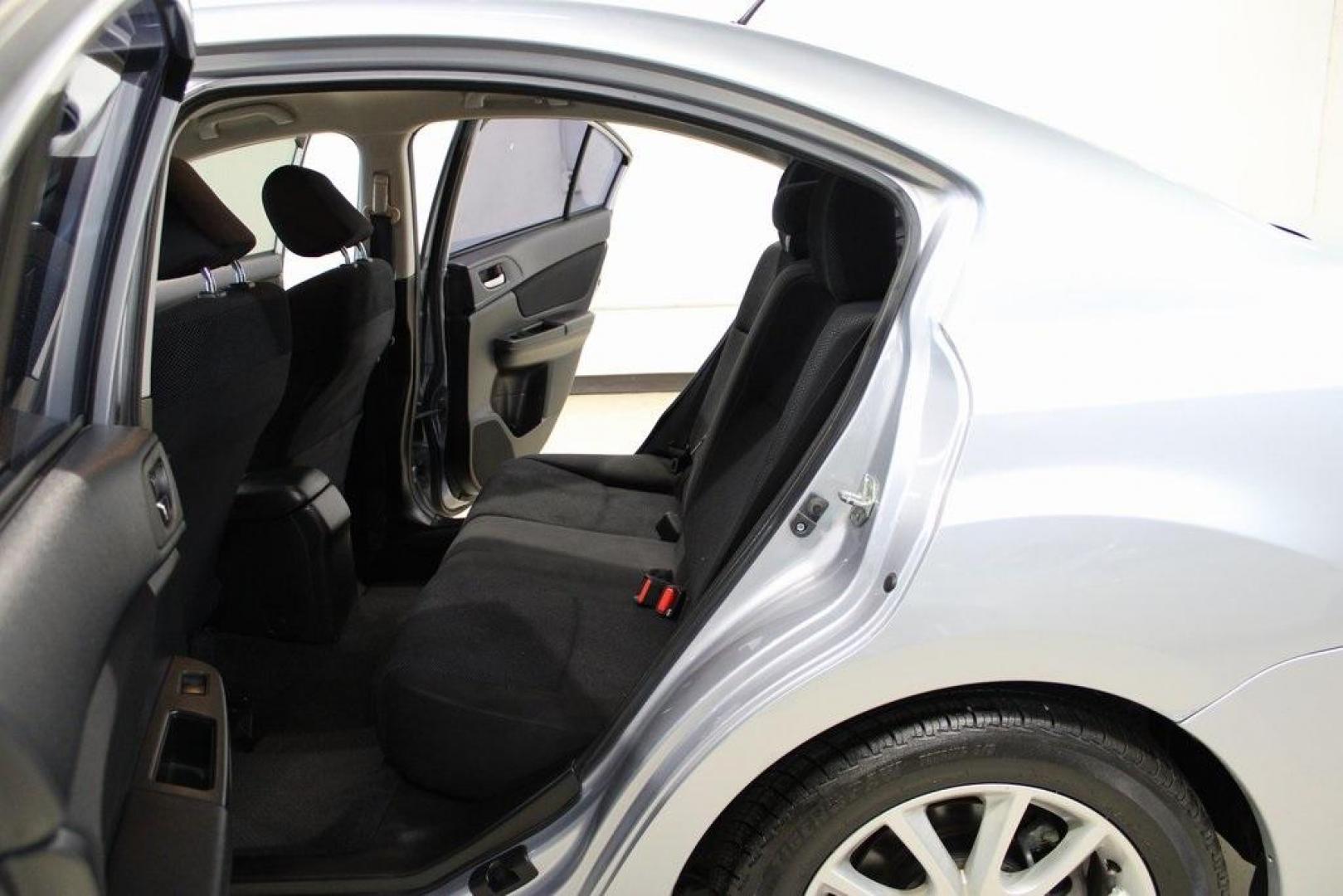 2013 Ice Silver Metallic /Black Subaru Impreza 2.0i Premium (JF1GJAB61DH) with an 2.0L 4-Cylinder SMPI DOHC 16V engine, CVT transmission, located at 15300 Midway Rd., Addison, TX, 75001, (972) 702-0011, 32.958321, -96.838074 - Introducing the 2013 Subaru Impreza 2.0i, now available at Midway Auto Group in Addison, Texas. This compact sedan seamlessly combines efficiency, versatility, and Subaru's renowned all-wheel-drive capability, making it an excellent choice for both city commutes and weekend adventures.<br><br>Key Fe - Photo#14