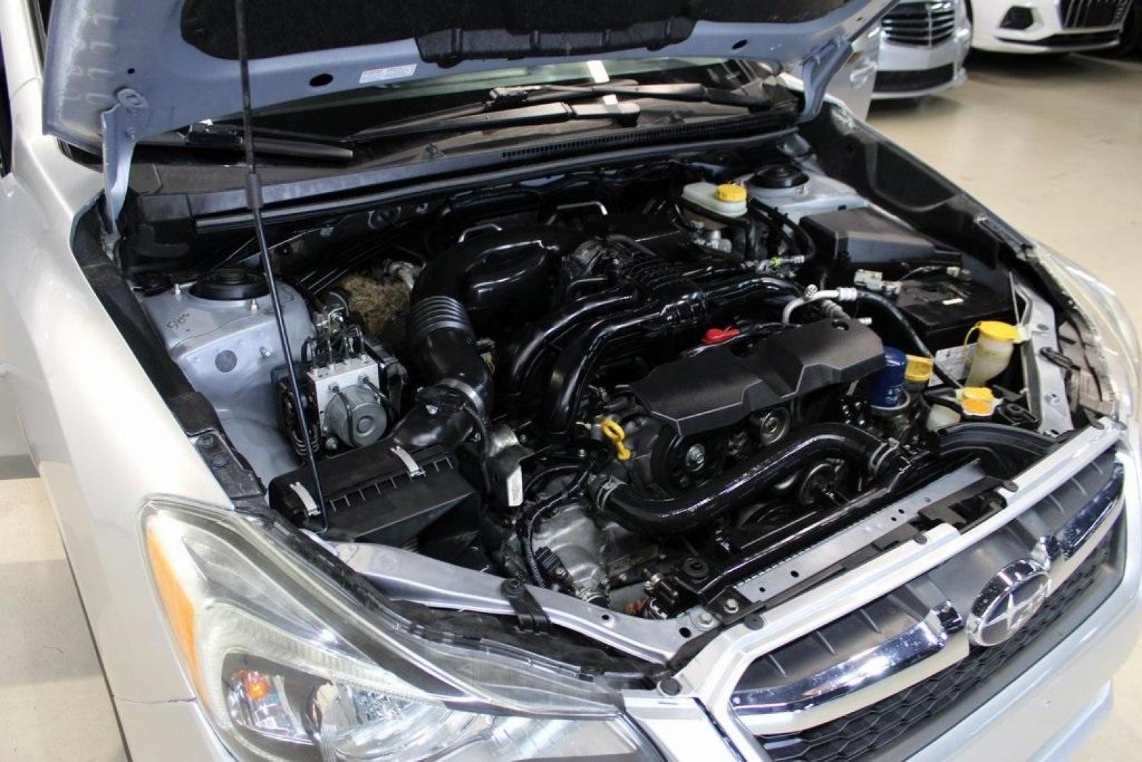 2013 Ice Silver Metallic /Black Subaru Impreza 2.0i Premium (JF1GJAB61DH) with an 2.0L 4-Cylinder SMPI DOHC 16V engine, CVT transmission, located at 15300 Midway Rd., Addison, TX, 75001, (972) 702-0011, 32.958321, -96.838074 - Introducing the 2013 Subaru Impreza 2.0i, now available at Midway Auto Group in Addison, Texas. This compact sedan seamlessly combines efficiency, versatility, and Subaru's renowned all-wheel-drive capability, making it an excellent choice for both city commutes and weekend adventures.<br><br>Key Fe - Photo#24