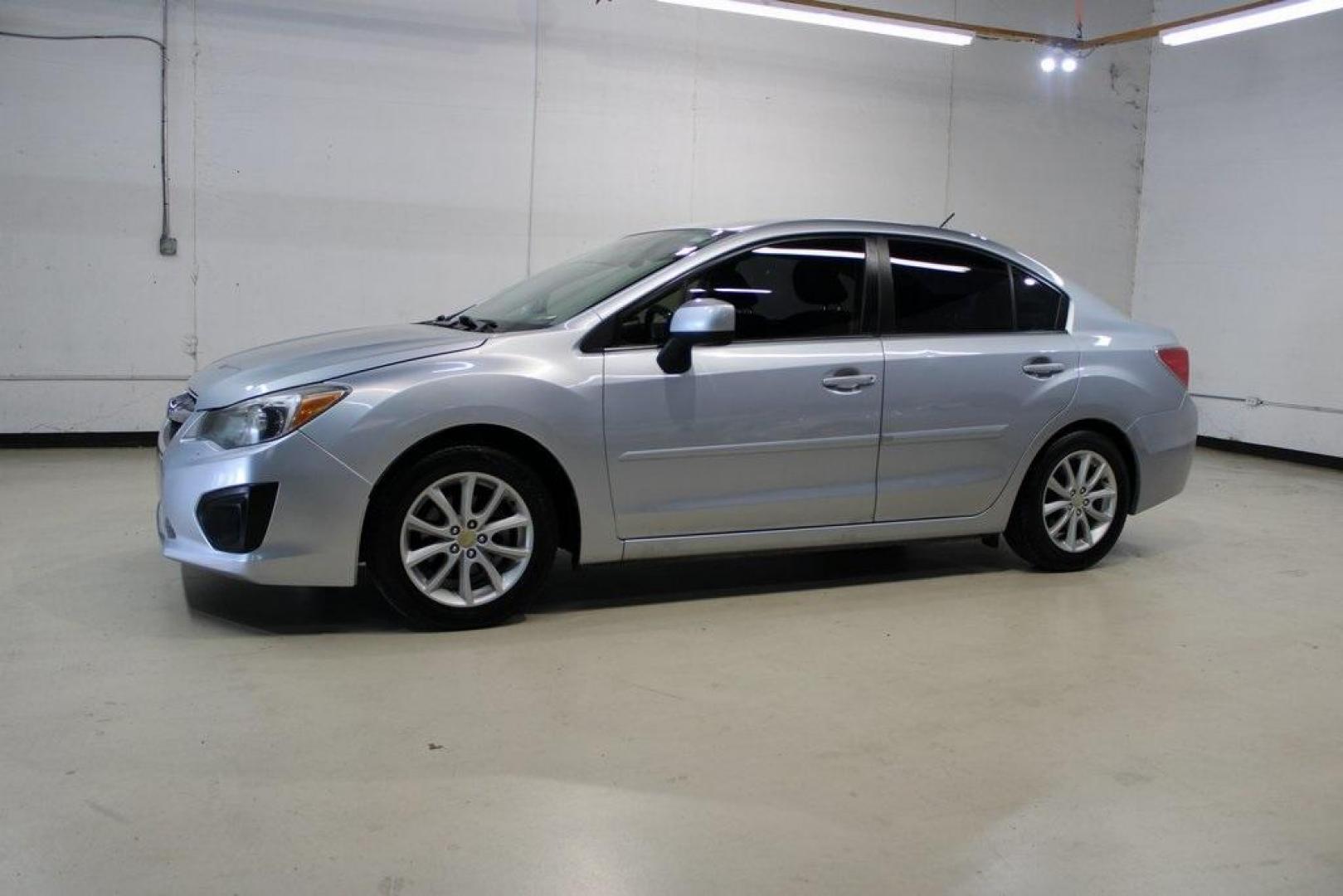 2013 Ice Silver Metallic /Black Subaru Impreza 2.0i Premium (JF1GJAB61DH) with an 2.0L 4-Cylinder SMPI DOHC 16V engine, CVT transmission, located at 15300 Midway Rd., Addison, TX, 75001, (972) 702-0011, 32.958321, -96.838074 - Introducing the 2013 Subaru Impreza 2.0i, now available at Midway Auto Group in Addison, Texas. This compact sedan seamlessly combines efficiency, versatility, and Subaru's renowned all-wheel-drive capability, making it an excellent choice for both city commutes and weekend adventures.<br><br>Key Fe - Photo#4