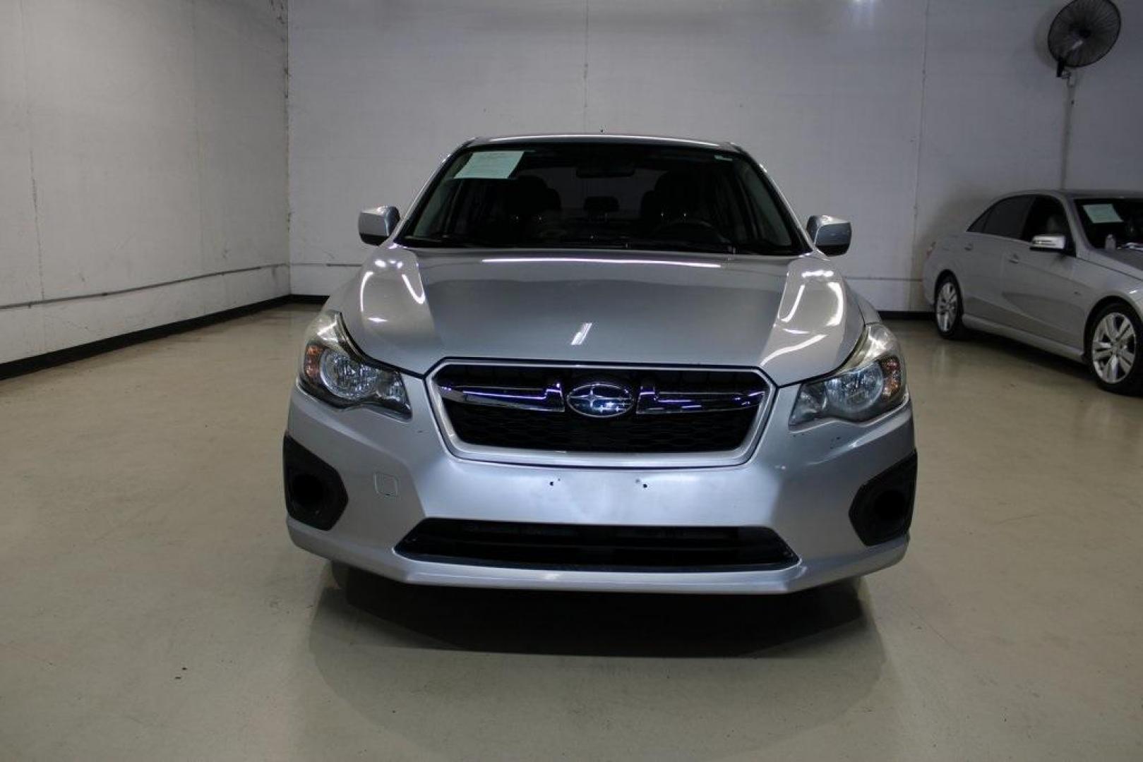 2013 Ice Silver Metallic /Black Subaru Impreza 2.0i Premium (JF1GJAB61DH) with an 2.0L 4-Cylinder SMPI DOHC 16V engine, CVT transmission, located at 15300 Midway Rd., Addison, TX, 75001, (972) 702-0011, 32.958321, -96.838074 - Introducing the 2013 Subaru Impreza 2.0i, now available at Midway Auto Group in Addison, Texas. This compact sedan seamlessly combines efficiency, versatility, and Subaru's renowned all-wheel-drive capability, making it an excellent choice for both city commutes and weekend adventures.<br><br>Key Fe - Photo#5