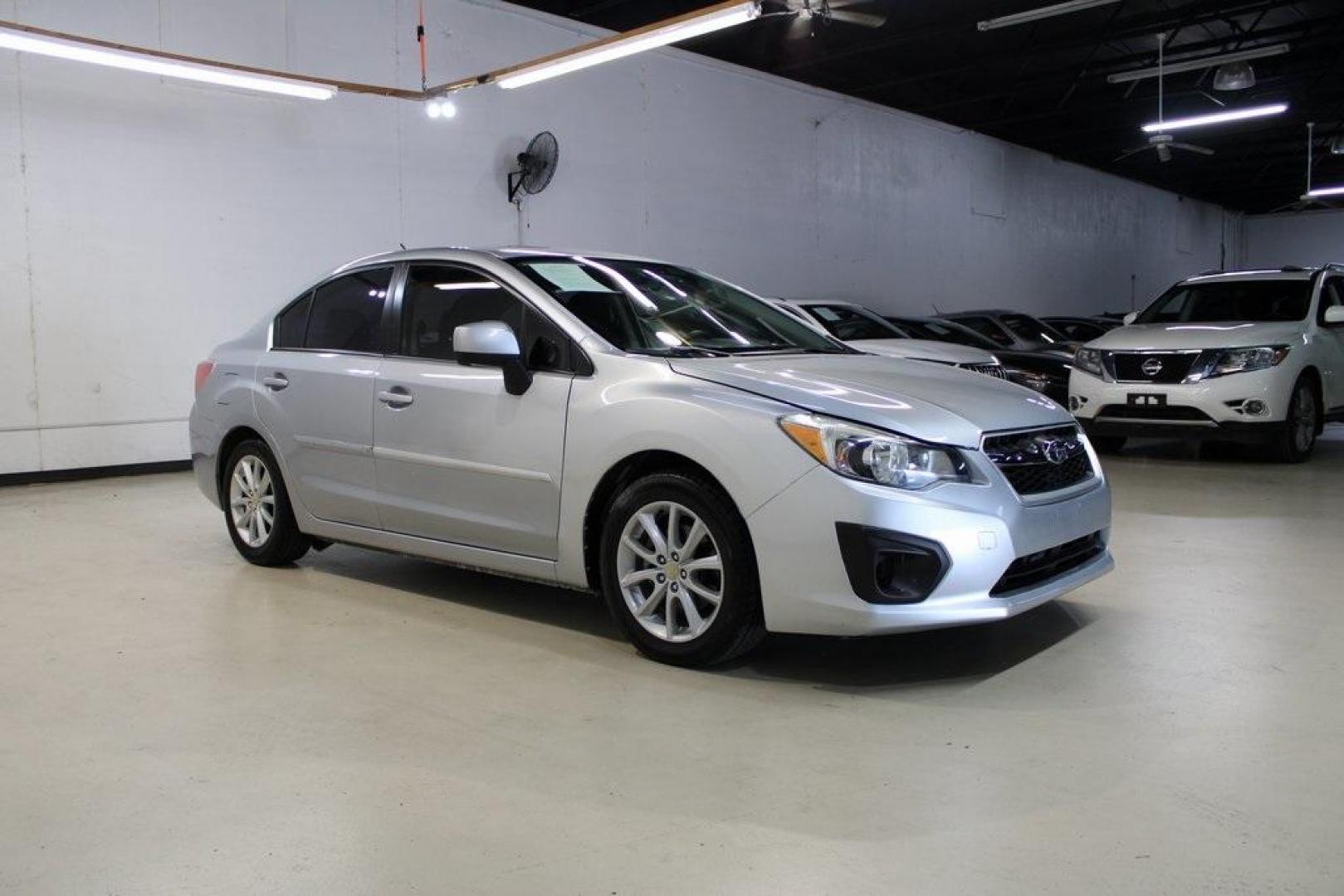 2013 Ice Silver Metallic /Black Subaru Impreza 2.0i Premium (JF1GJAB61DH) with an 2.0L 4-Cylinder SMPI DOHC 16V engine, CVT transmission, located at 15300 Midway Rd., Addison, TX, 75001, (972) 702-0011, 32.958321, -96.838074 - Introducing the 2013 Subaru Impreza 2.0i, now available at Midway Auto Group in Addison, Texas. This compact sedan seamlessly combines efficiency, versatility, and Subaru's renowned all-wheel-drive capability, making it an excellent choice for both city commutes and weekend adventures.<br><br>Key Fe - Photo#6