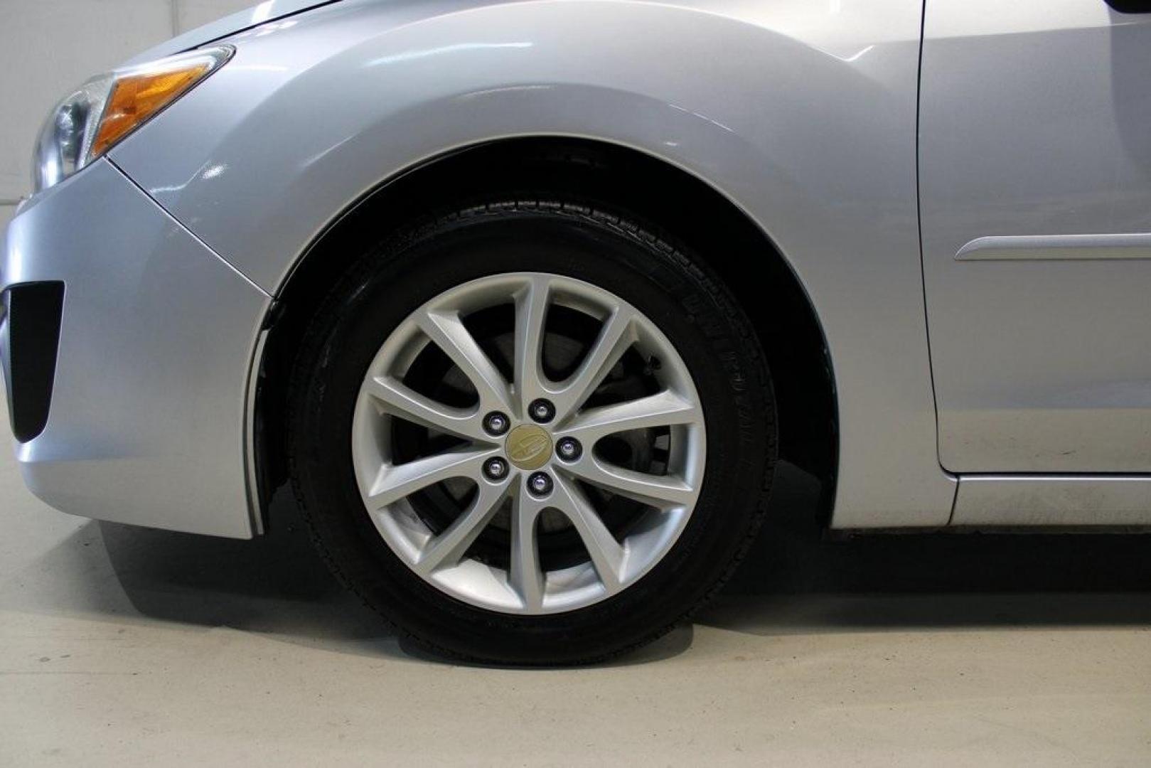 2013 Ice Silver Metallic /Black Subaru Impreza 2.0i Premium (JF1GJAB61DH) with an 2.0L 4-Cylinder SMPI DOHC 16V engine, CVT transmission, located at 15300 Midway Rd., Addison, TX, 75001, (972) 702-0011, 32.958321, -96.838074 - Introducing the 2013 Subaru Impreza 2.0i, now available at Midway Auto Group in Addison, Texas. This compact sedan seamlessly combines efficiency, versatility, and Subaru's renowned all-wheel-drive capability, making it an excellent choice for both city commutes and weekend adventures.<br><br>Key Fe - Photo#8