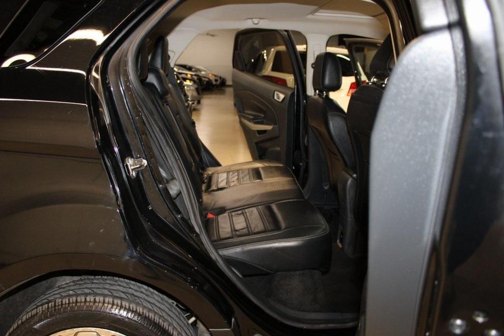 2018 Shadow Black /Black Ford EcoSport Titanium (MAJ3P1VE7JC) with an EcoBoost 1.0L I3 GTDi DOHC Turbocharged VCT engine, Automatic transmission, located at 15300 Midway Rd., Addison, TX, 75001, (972) 702-0011, 32.958321, -96.838074 - Introducing the 2018 Ford EcoSport SE, now available at Midway Auto Group in Addison, Texas. This compact SUV seamlessly blends efficiency, versatility, and modern features, making it an excellent choice for urban commutes and weekend adventures alike.<br><br>Key Features:<br><br>Engine: 1.0L EcoBoo - Photo#15
