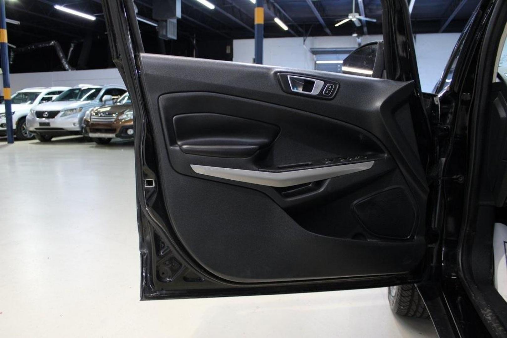2018 Shadow Black /Black Ford EcoSport Titanium (MAJ3P1VE7JC) with an EcoBoost 1.0L I3 GTDi DOHC Turbocharged VCT engine, Automatic transmission, located at 15300 Midway Rd., Addison, TX, 75001, (972) 702-0011, 32.958321, -96.838074 - Introducing the 2018 Ford EcoSport SE, now available at Midway Auto Group in Addison, Texas. This compact SUV seamlessly blends efficiency, versatility, and modern features, making it an excellent choice for urban commutes and weekend adventures alike.<br><br>Key Features:<br><br>Engine: 1.0L EcoBoo - Photo#26