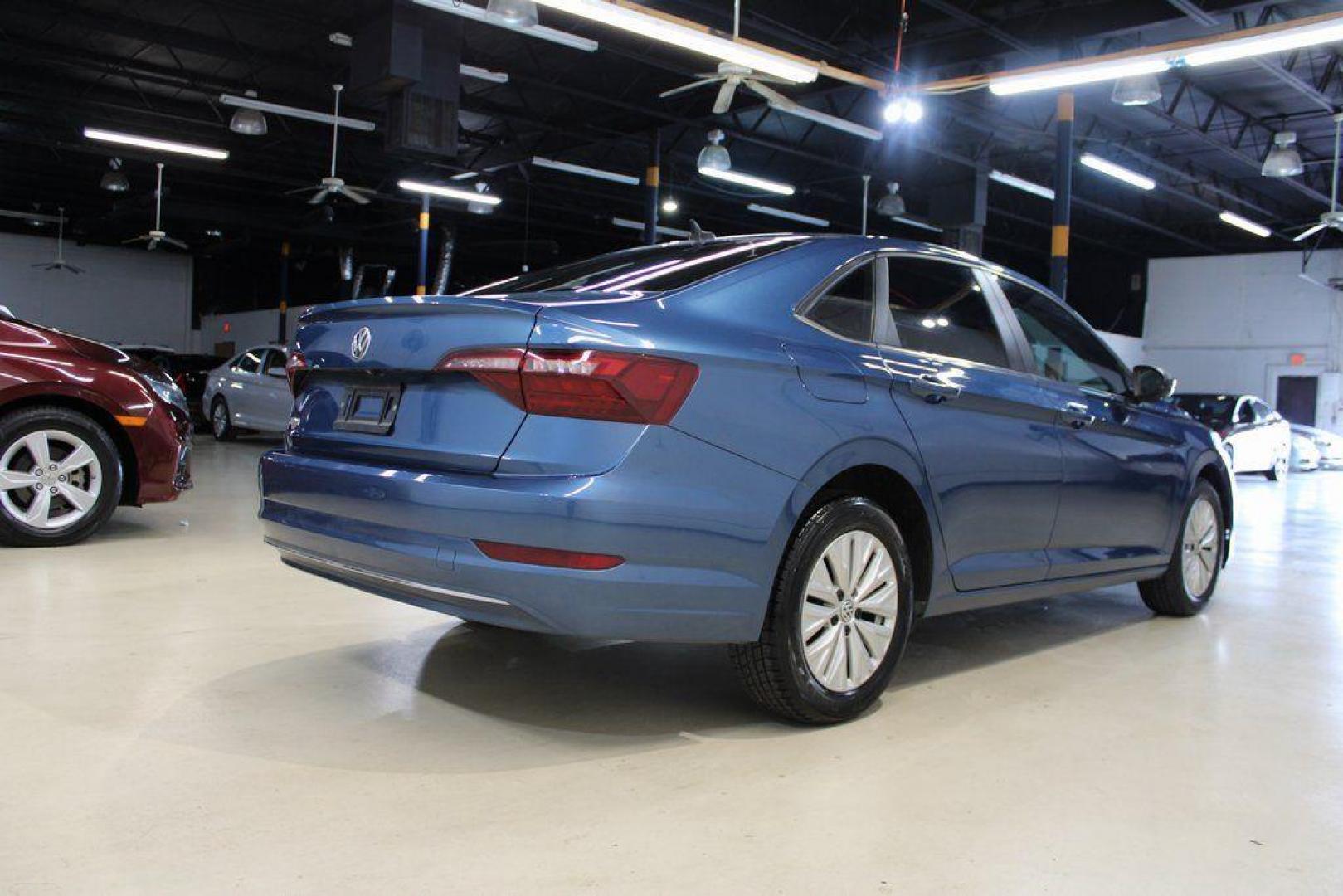 2020 Silk /Black Volkswagen Jetta 1.4T S (3VWCB7BU6LM) with an 1.4L TSI engine, Automatic transmission, located at 15300 Midway Rd., Addison, TX, 75001, (972) 702-0011, 32.958321, -96.838074 - HOME OF THE NO HAGGLE PRICE - WHOLESALE PRICES TO THE PUBLIC!! Priced below KBB Fair Purchase Price!<br><br>Blue Silk Metallic 2020 Volkswagen Jetta 1.4T S<br><br>30/40 City/Highway MPG<br><br>Awards:<br> * 2020 KBB.com 10 Coolest New Cars Under $20,000<br><br>At Midway Auto Group, we strive to pro - Photo#2