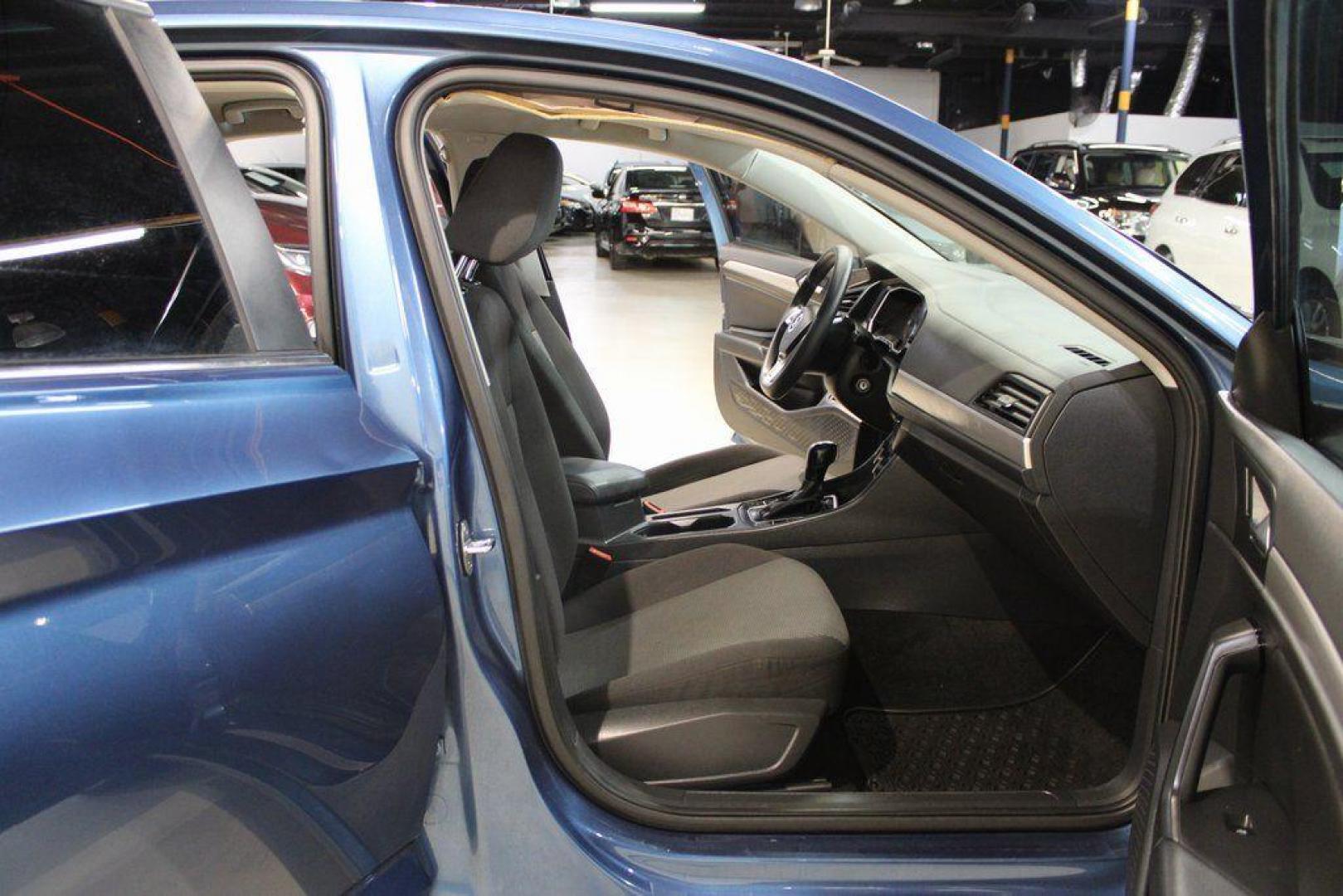 2020 Silk /Black Volkswagen Jetta 1.4T S (3VWCB7BU6LM) with an 1.4L TSI engine, Automatic transmission, located at 15300 Midway Rd., Addison, TX, 75001, (972) 702-0011, 32.958321, -96.838074 - HOME OF THE NO HAGGLE PRICE - WHOLESALE PRICES TO THE PUBLIC!! Priced below KBB Fair Purchase Price!<br><br>Blue Silk Metallic 2020 Volkswagen Jetta 1.4T S<br><br>30/40 City/Highway MPG<br><br>Awards:<br> * 2020 KBB.com 10 Coolest New Cars Under $20,000<br><br>At Midway Auto Group, we strive to pro - Photo#13