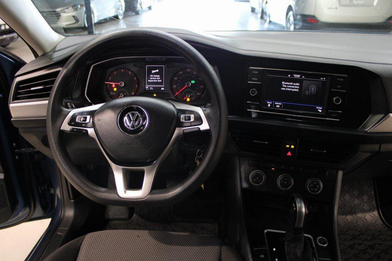 2020 Silk /Black Volkswagen Jetta 1.4T S (3VWCB7BU6LM) with an 1.4L TSI engine, Automatic transmission, located at 15300 Midway Rd., Addison, TX, 75001, (972) 702-0011, 32.958321, -96.838074 - HOME OF THE NO HAGGLE PRICE - WHOLESALE PRICES TO THE PUBLIC!! Priced below KBB Fair Purchase Price!<br><br>Blue Silk Metallic 2020 Volkswagen Jetta 1.4T S<br><br>30/40 City/Highway MPG<br><br>Awards:<br> * 2020 KBB.com 10 Coolest New Cars Under $20,000<br><br>At Midway Auto Group, we strive to pro - Photo#16