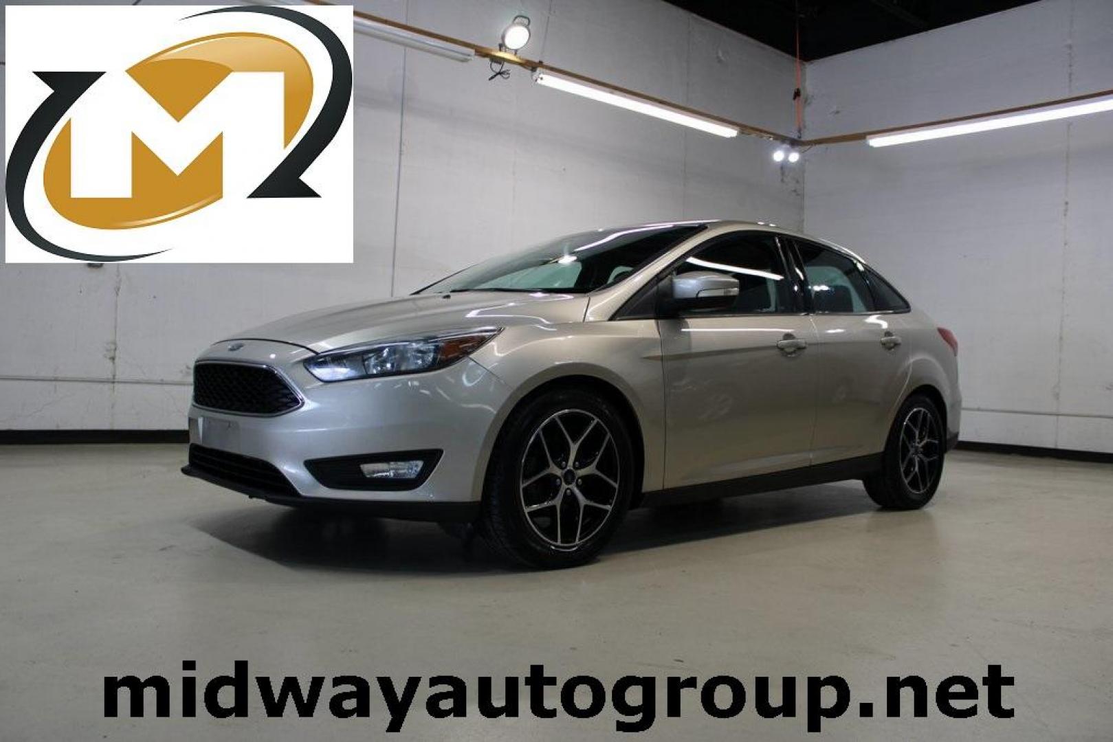 2017 White Gold /Charcoal Black Ford Focus SEL (1FADP3H24HL) with an I4 engine, Automatic transmission, located at 15300 Midway Rd., Addison, TX, 75001, (972) 702-0011, 32.958321, -96.838074 - Photo#0
