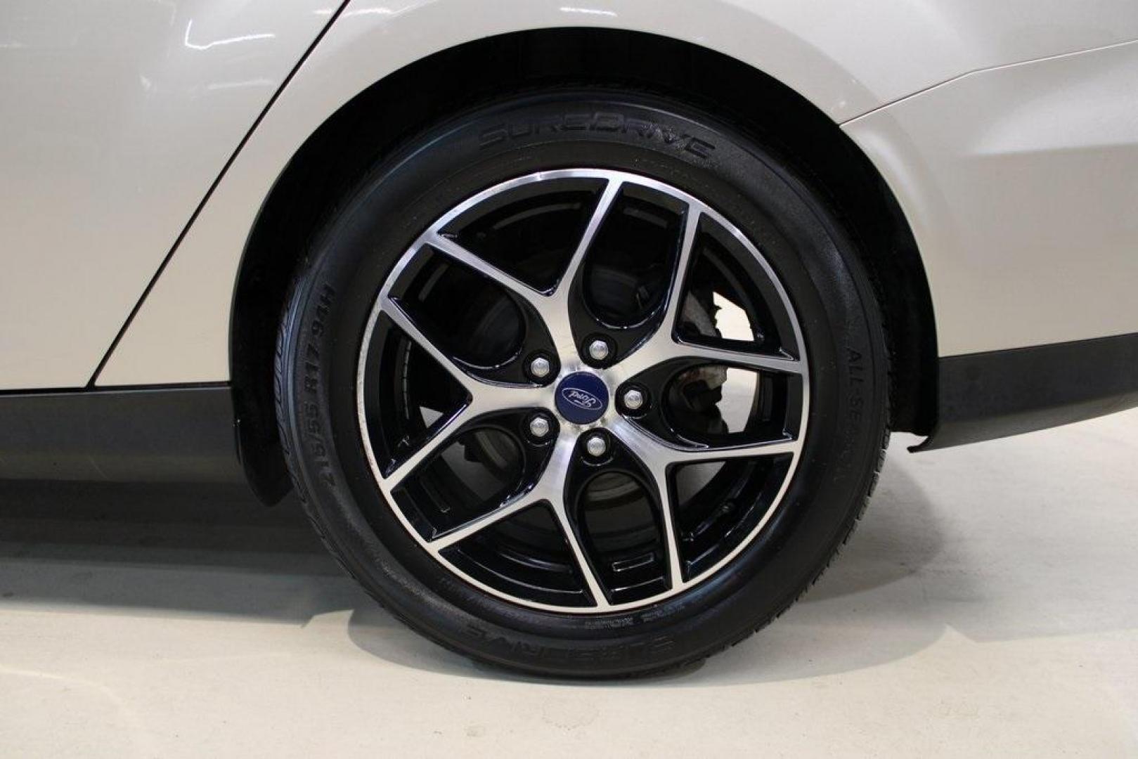 2017 White Gold /Charcoal Black Ford Focus SEL (1FADP3H24HL) with an I4 engine, Automatic transmission, located at 15300 Midway Rd., Addison, TX, 75001, (972) 702-0011, 32.958321, -96.838074 - Photo#9