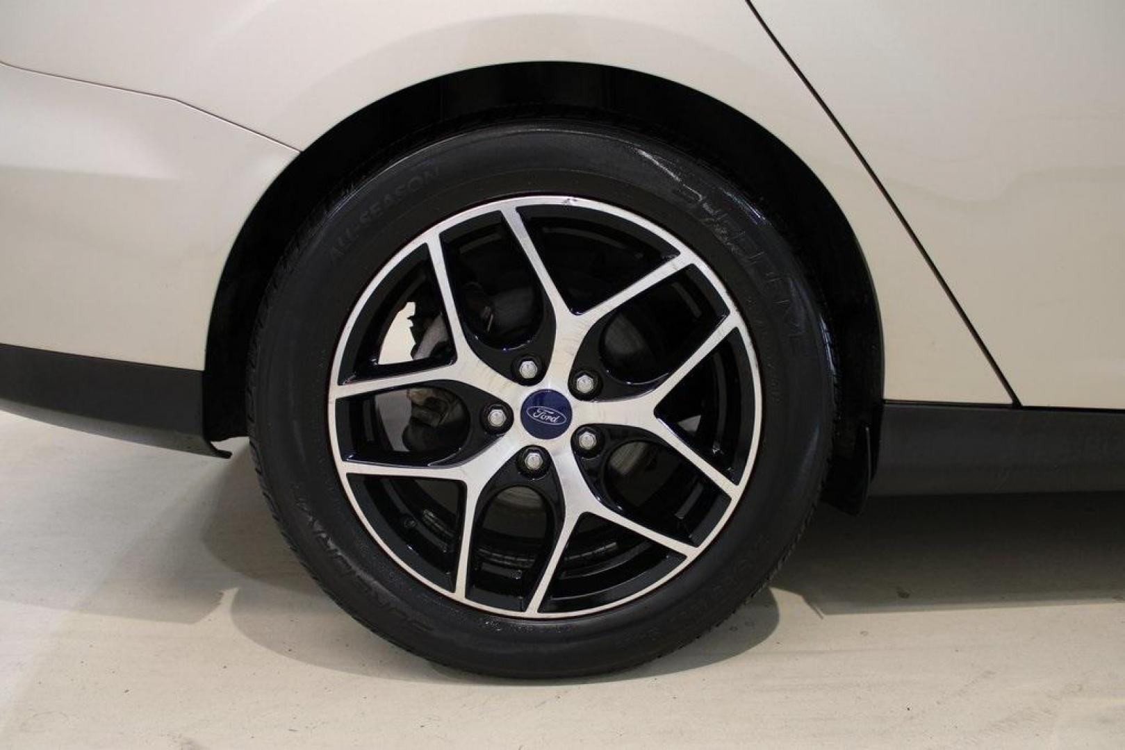 2017 White Gold /Charcoal Black Ford Focus SEL (1FADP3H24HL) with an I4 engine, Automatic transmission, located at 15300 Midway Rd., Addison, TX, 75001, (972) 702-0011, 32.958321, -96.838074 - Photo#10
