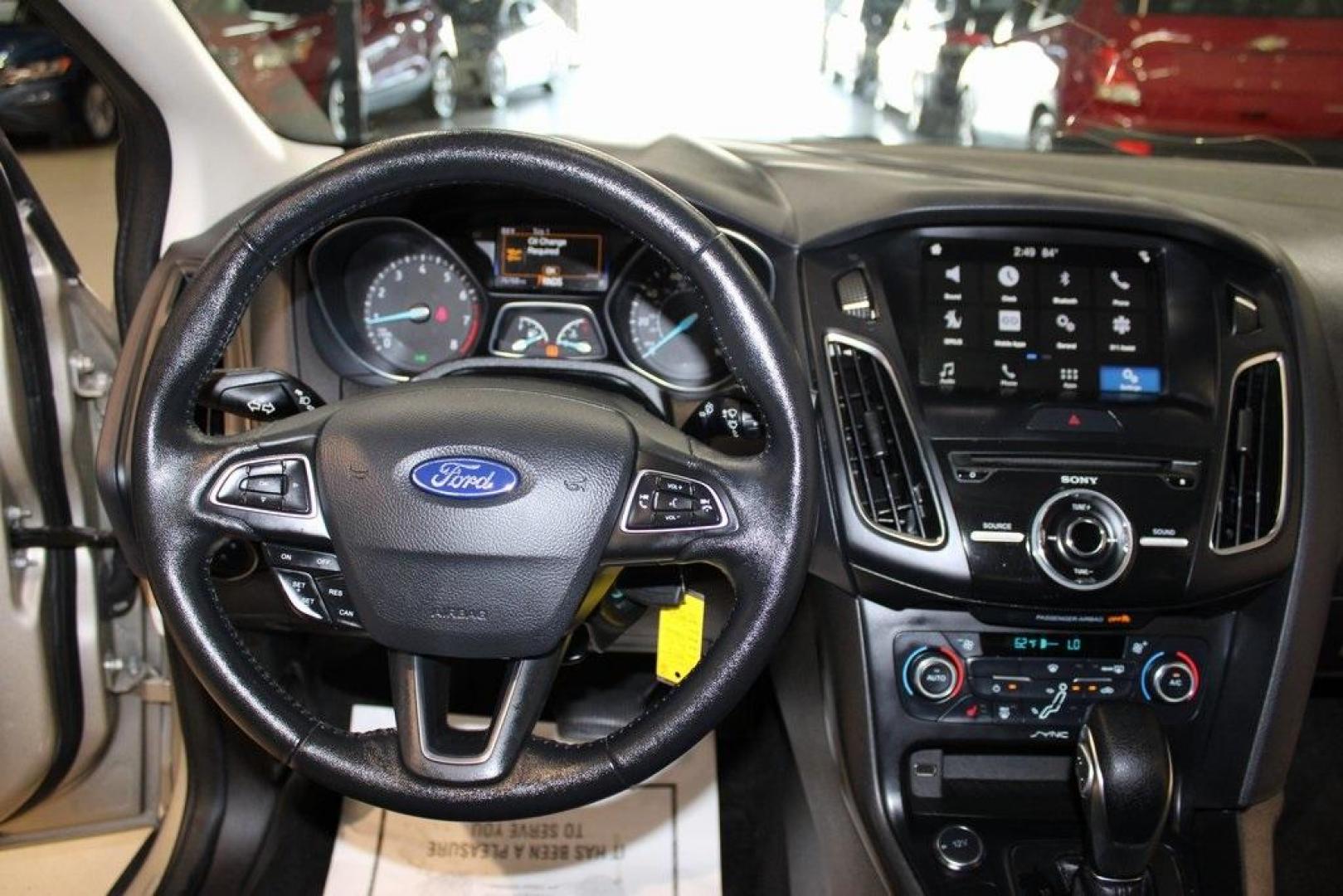 2017 White Gold /Charcoal Black Ford Focus SEL (1FADP3H24HL) with an I4 engine, Automatic transmission, located at 15300 Midway Rd., Addison, TX, 75001, (972) 702-0011, 32.958321, -96.838074 - Photo#16