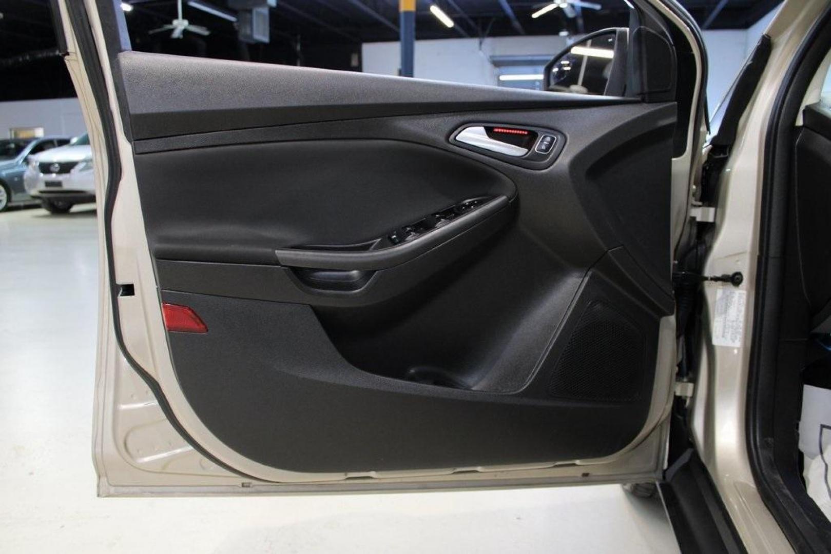 2017 White Gold /Charcoal Black Ford Focus SEL (1FADP3H24HL) with an I4 engine, Automatic transmission, located at 15300 Midway Rd., Addison, TX, 75001, (972) 702-0011, 32.958321, -96.838074 - Photo#24