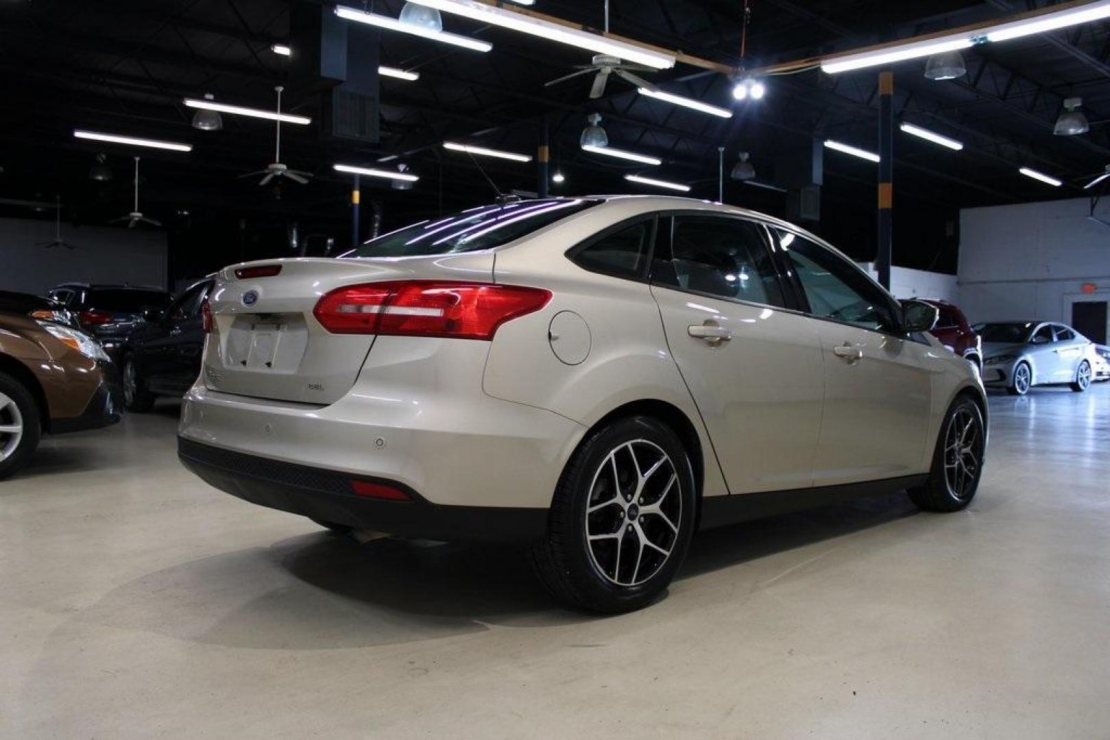 2017 White Gold /Charcoal Black Ford Focus SEL (1FADP3H24HL) with an I4 engine, Automatic transmission, located at 15300 Midway Rd., Addison, TX, 75001, (972) 702-0011, 32.958321, -96.838074 - Photo#2