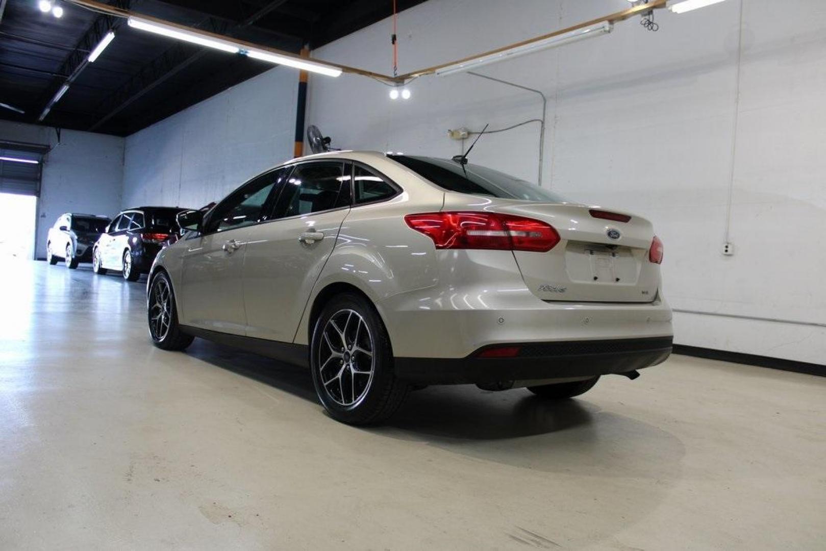 2017 White Gold /Charcoal Black Ford Focus SEL (1FADP3H24HL) with an I4 engine, Automatic transmission, located at 15300 Midway Rd., Addison, TX, 75001, (972) 702-0011, 32.958321, -96.838074 - Photo#3