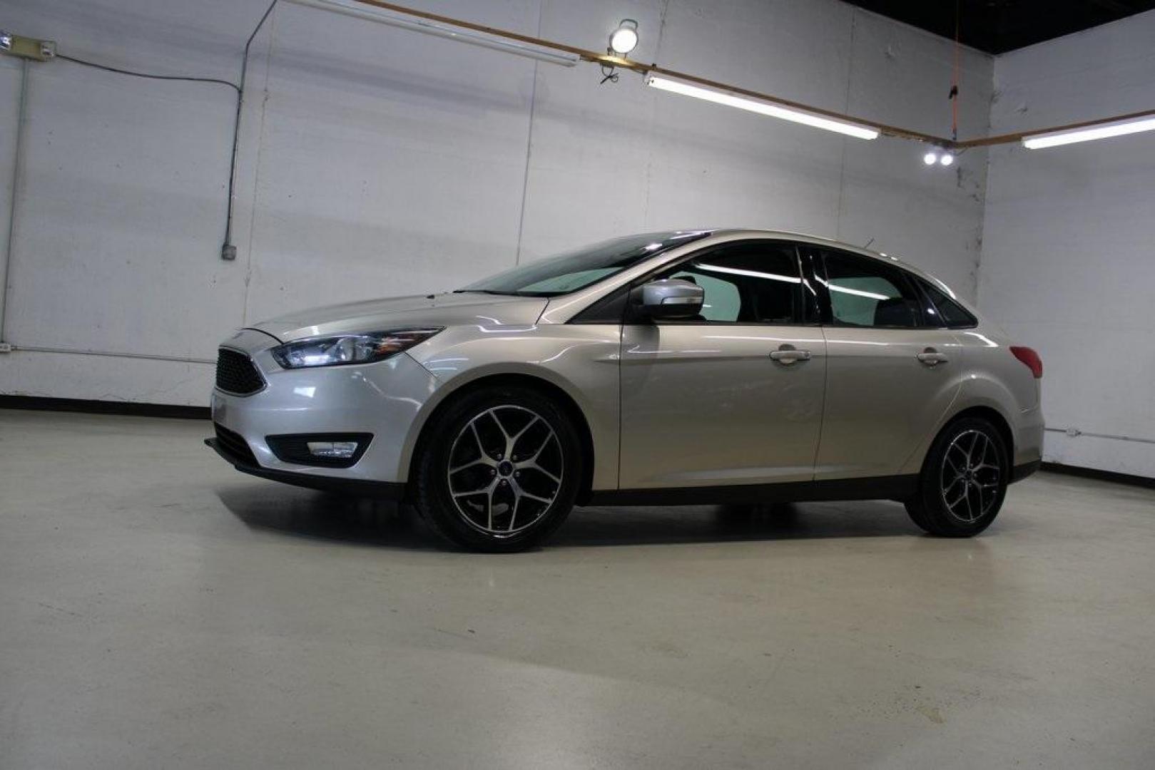 2017 White Gold /Charcoal Black Ford Focus SEL (1FADP3H24HL) with an I4 engine, Automatic transmission, located at 15300 Midway Rd., Addison, TX, 75001, (972) 702-0011, 32.958321, -96.838074 - Photo#4