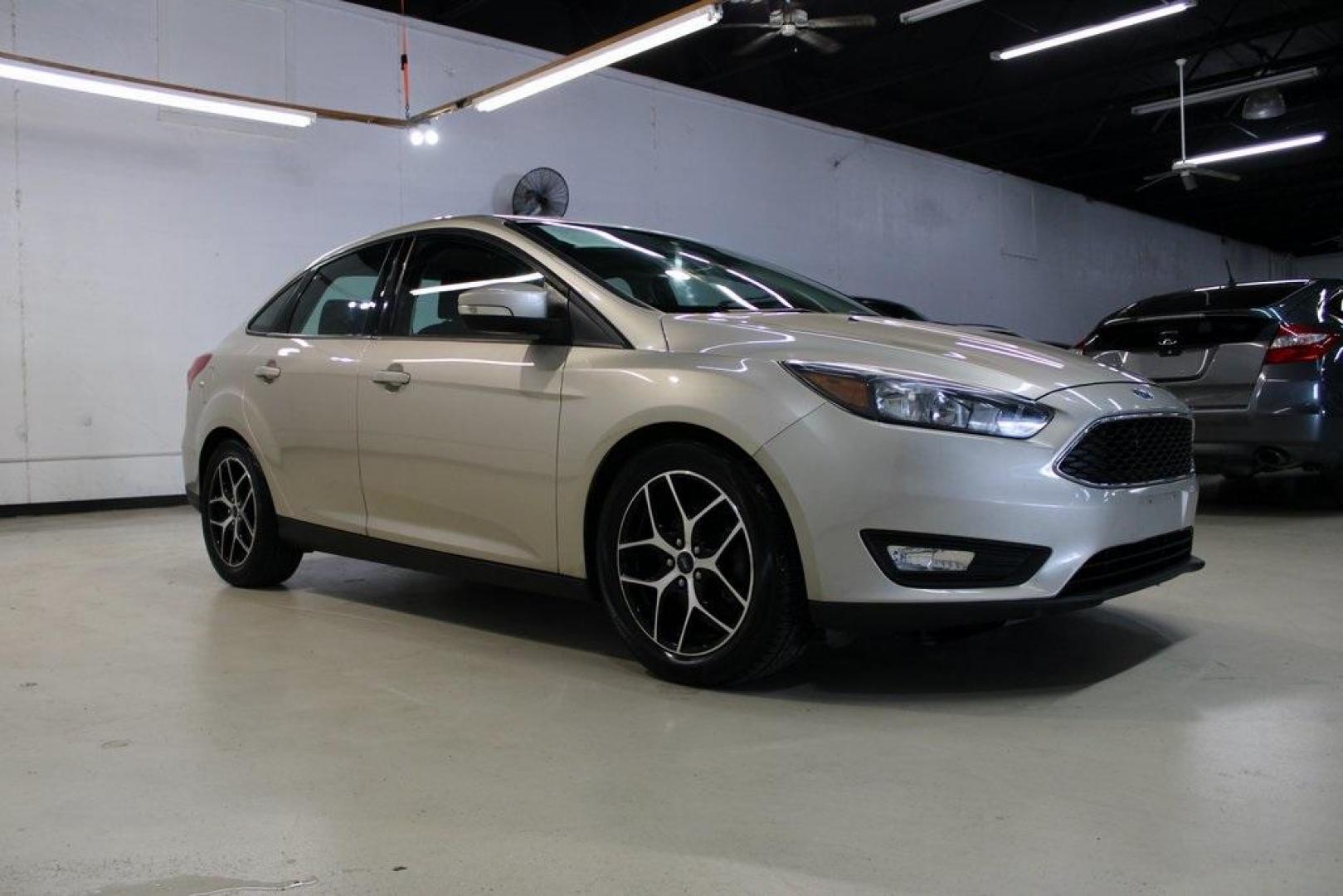 2017 White Gold /Charcoal Black Ford Focus SEL (1FADP3H24HL) with an I4 engine, Automatic transmission, located at 15300 Midway Rd., Addison, TX, 75001, (972) 702-0011, 32.958321, -96.838074 - Photo#6